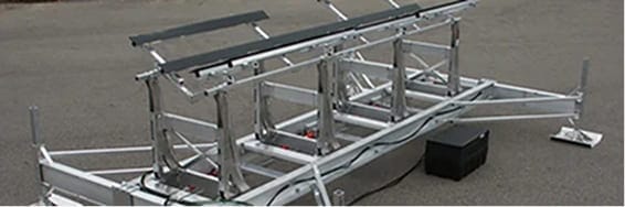 Aluminum boat lift system on a dock for easy boat access and storage.