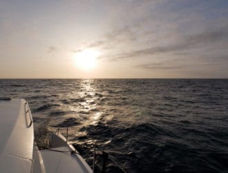 Sailing with a bronze sunset leaving Avalon, Catalina Island.
