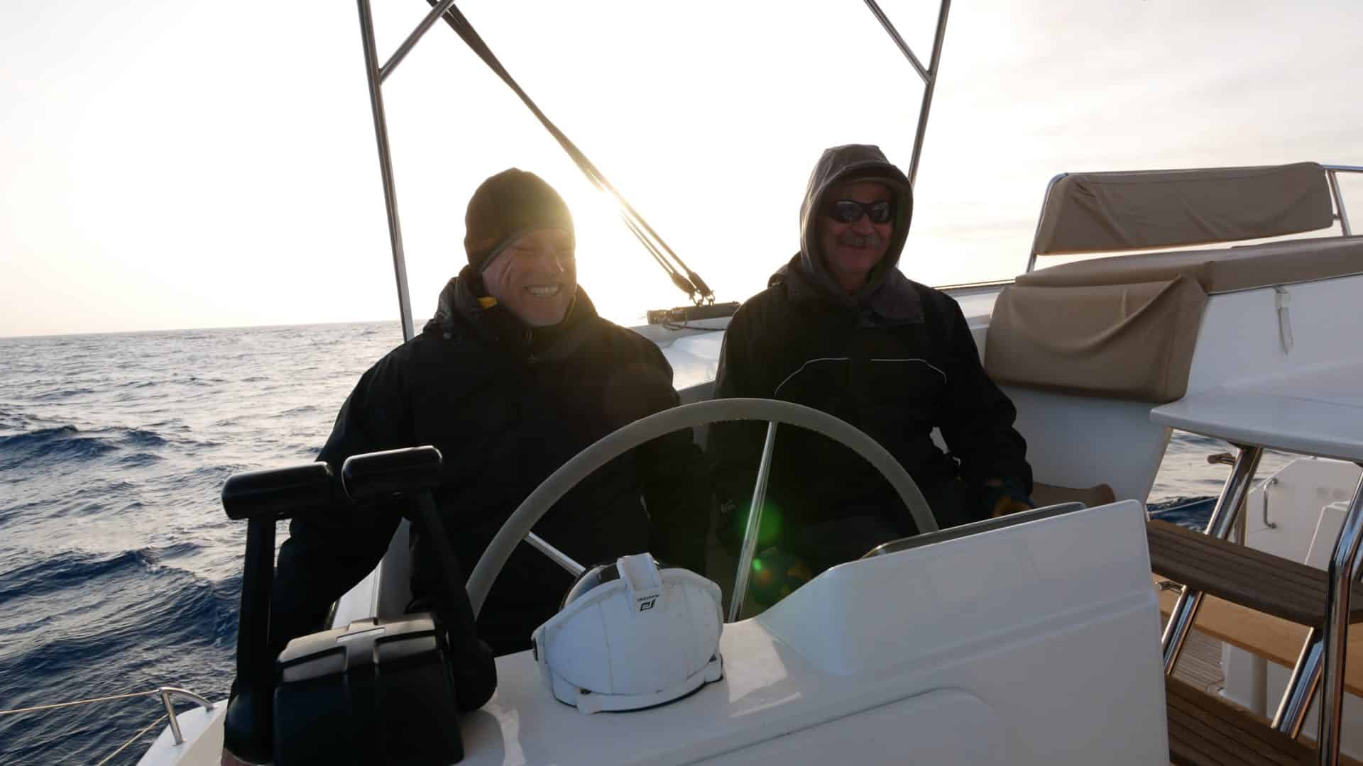 Captain Chas and Tim at the helm of a Fountaine Pajot Helia 44