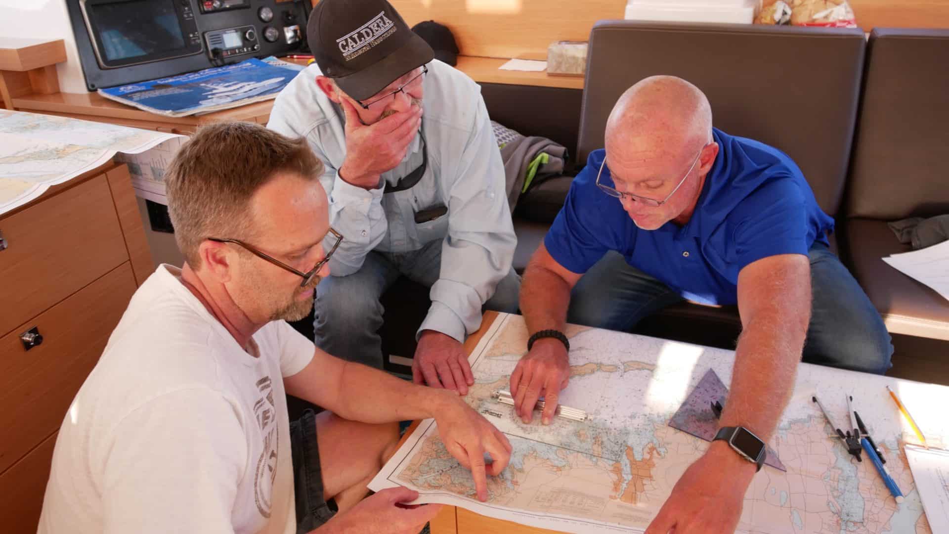 Matt, Tim Capt. Chas working on Coastal Navigation