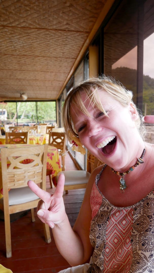 Emily making peace sign and laughing