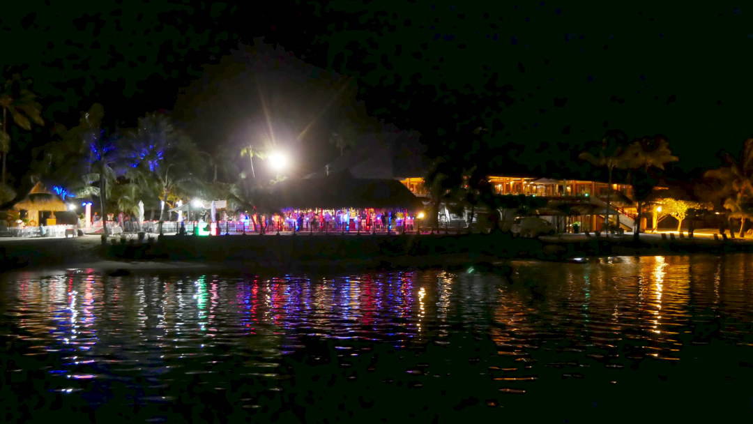Lance Gala Dinner in Moorea at night with colorful lights
