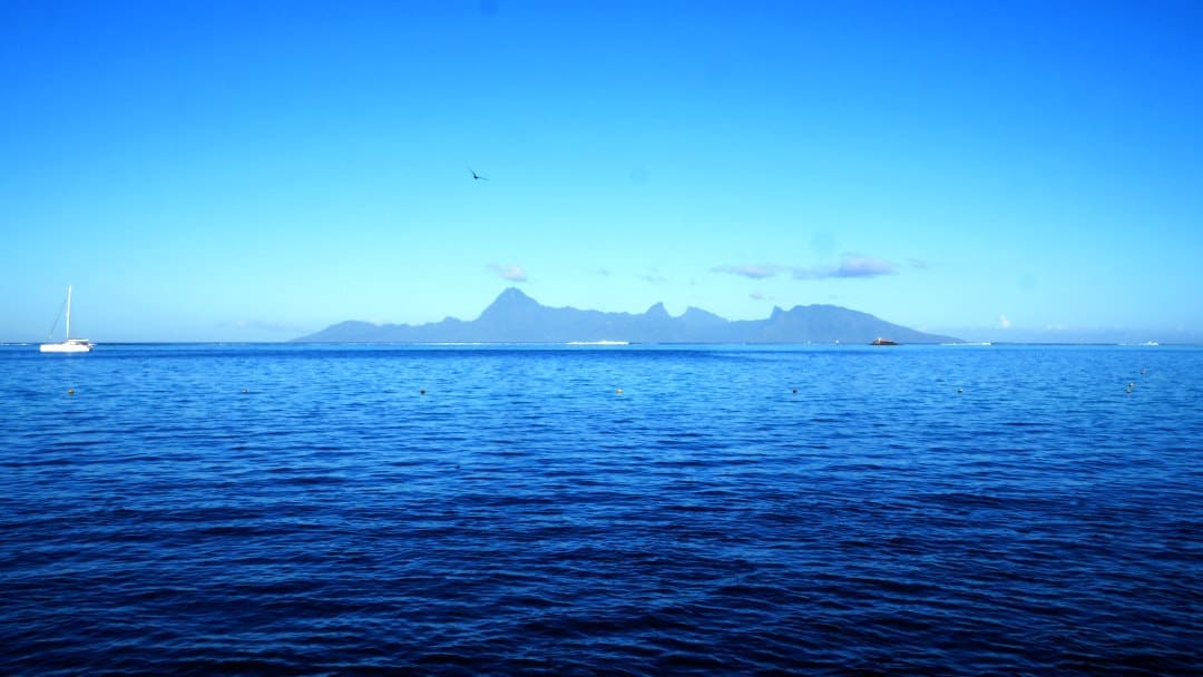 Blue sky and water with Moorea island in distance