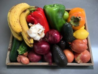 Wooden dish full of colorful vegetables