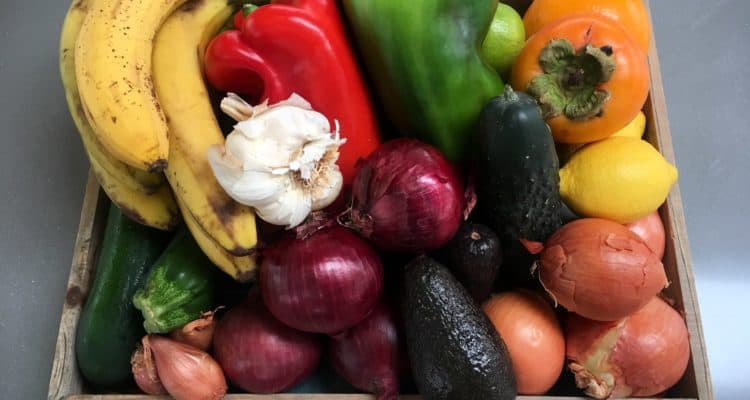 Wooden dish full of colorful vegetables
