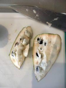 cut chirimoya on a cutting board