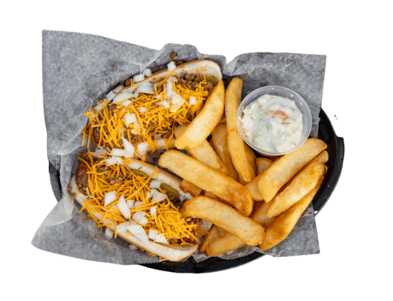 Hot dog with shredded cheese, onions, and fries with dipping sauce on side.