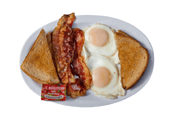 Bacon, eggs, toast, and sausage on a white plate at Dog House Saloon.