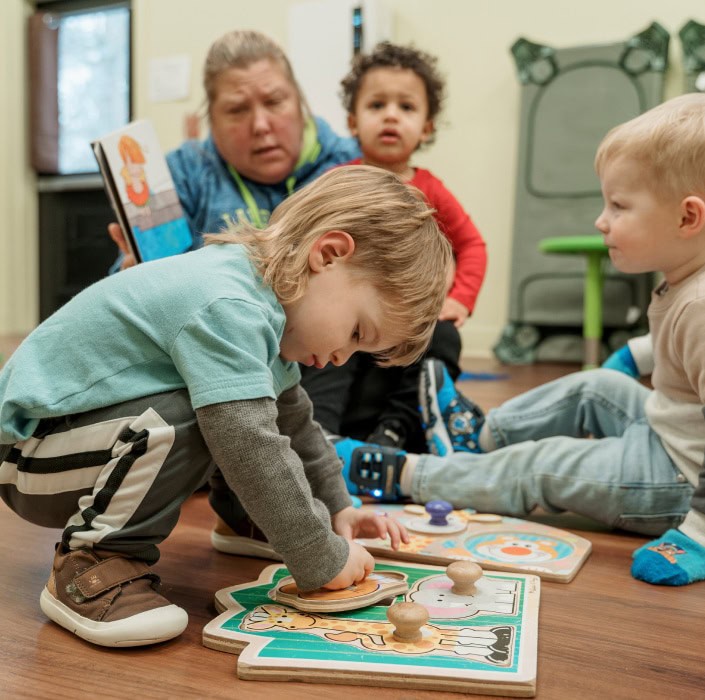 Little boy playing with puzzle