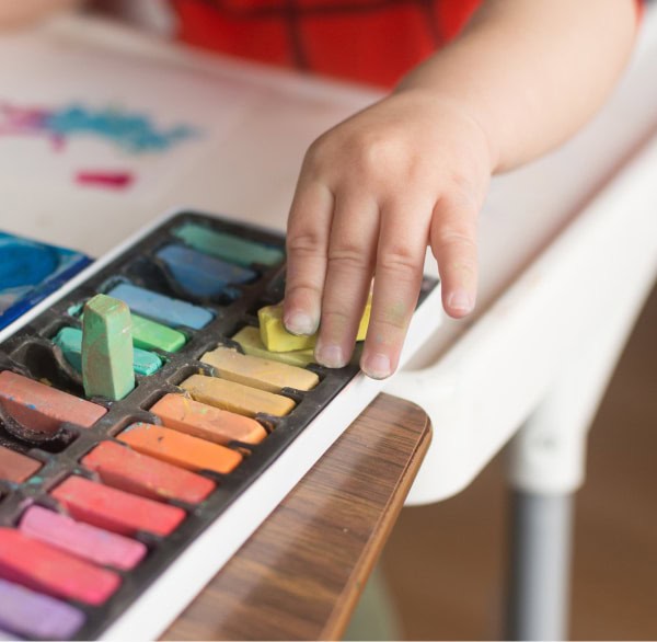 child playing with chalk