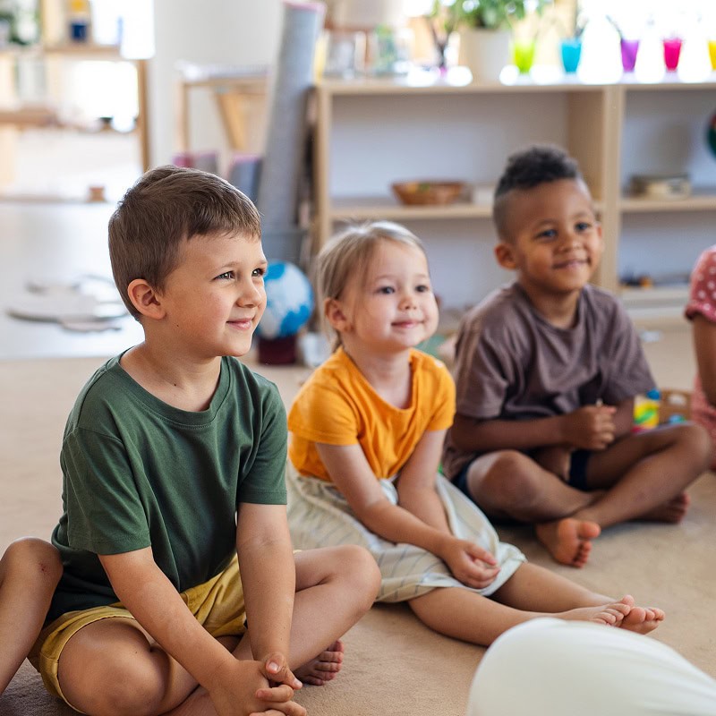 elementary kids sitting in circle