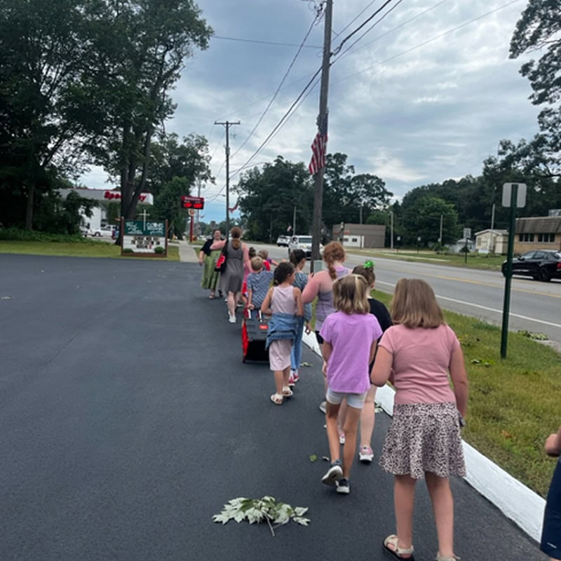 summer camp class taking a walk