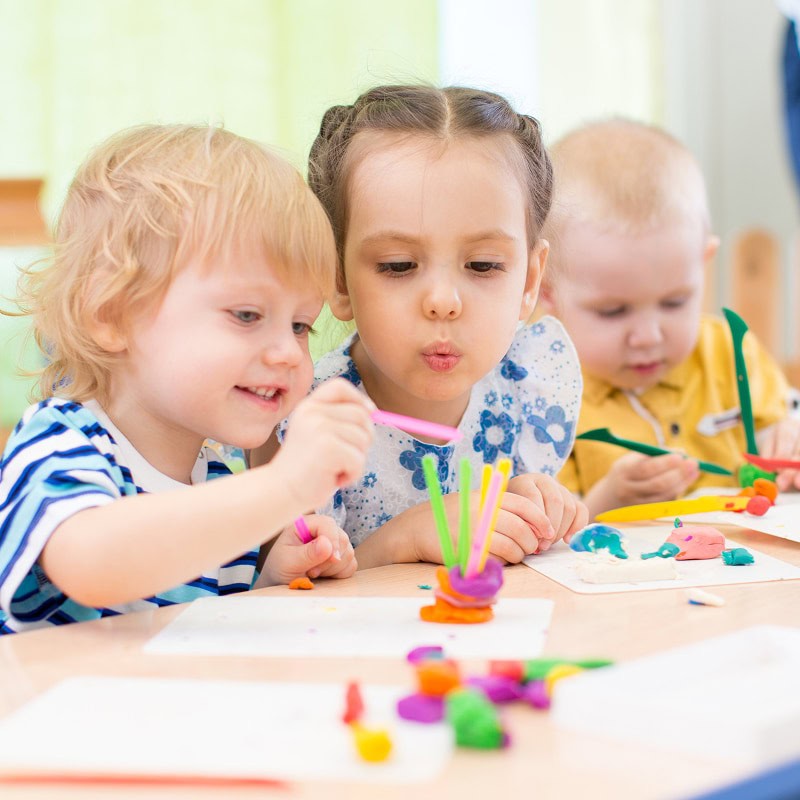 young kids doing arts and crafts