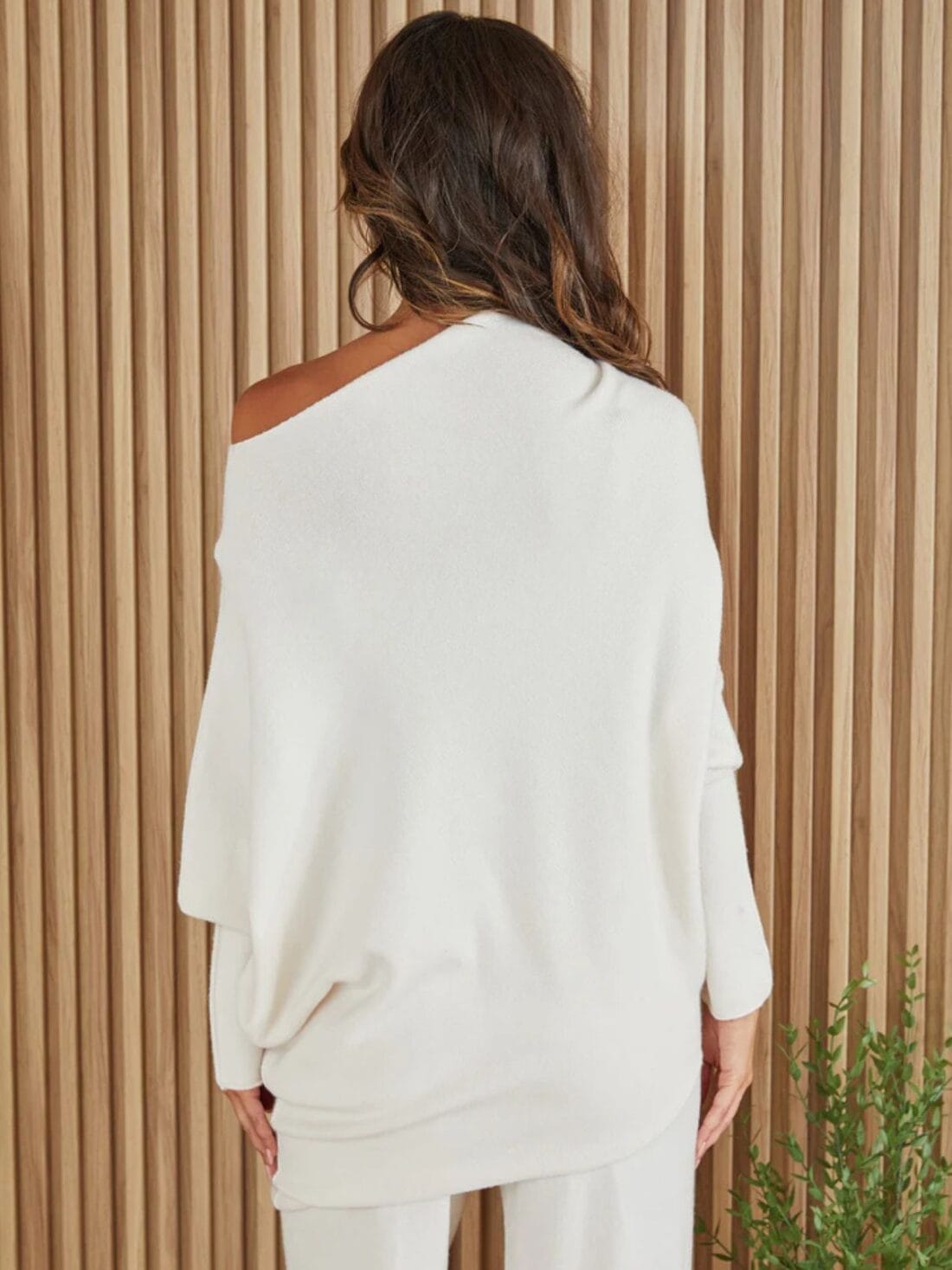 cotton island asymmetrical sweater in white