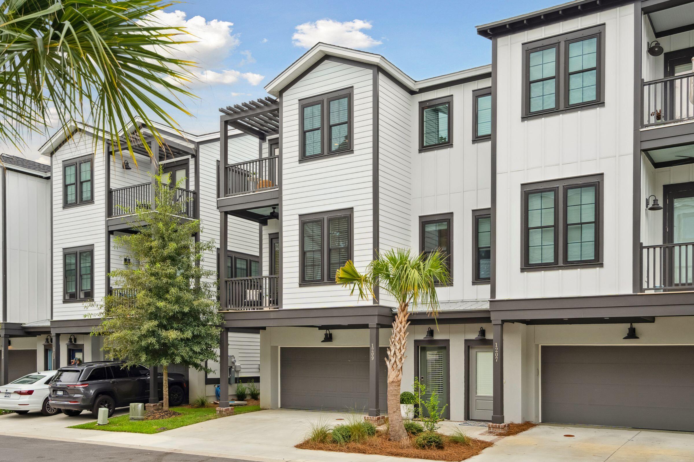 Welcome to 1209 Gatch Court, a stunning 2021 build nestled in the heart of South Mount Pleasant. Ride your bike to Shem Creek or Sullivan's Island beaches! This townhome residence exemplifies refined lock-and-leave living at its finest, combining enduring design and custom selections from local purveyors like Circa Lighting.The exterior facade blends modern and timeless Lowcountry elements while the open-concept floor plan seamlessly blends contemporary elements with southern charm, creating a truly remarkable living space thanks to the 10ft ceilings on the main floor.The living area is bathed in natural light courtesy of large and ample windows on this end unit home. The high ceilings and beautiful flooring create a space for you to bring your personal style to this home in an elegant and sophisticated way.

The bright kitchen is open and inviting, featuring upgraded Bosch stainless steel appliances, sleek quartz countertops, and an abundance of storage space. Whether you're hosting a lavish dinner party or enjoying a quiet breakfast at the oversized island, this kitchen is sure to impress even the most discerning chefs. And don't forget, this home is equipped with an elevator shaft should you decide to install a lift at a later date. 

Upstairs you will find the owners' suite, a private oasis designed for ultimate relaxation. Unwind in the spa-like ensuite bathroom, complete with a spacious walk-in shower and dual vanities. The generously sized walk-in closet provides ample storage space for your wardrobe and custom built-ins offer thoughtful organization throughout.

This townhome also offers two additional well-appointed bedrooms, one on the ground floor, each with its own ensuite bathroom, ensuring the utmost comfort for family members or guests. A dedicated home office provides the perfect space for productivity, while a versatile loft area can be transformed into a media room or a cozy reading nook in the Owners' suite.

Step outside onto your private patio, where you can enjoy a Lowcountry breeze or entertain guests for a cocktail. With multiple porches and a private, screened-in patio, you have the perfect amount of outdoor space minus the maintenance of a large yard. 

Located in the heart of South Mount Pleasant, you'll have easy access to many amenities. Explore the vibrant local dining scene, indulge in upscale shopping, or take a leisurely stroll through the nearby parks and recreational areas.

With its unrivaled combination of location and style, 1209 Gatch Court presents an unparalleled opportunity for those seeking the Lowcountry lifestyle in South Mount Pleasant without the maintenance concerns of other homes. Schedule a private viewing today. Townhomes in South Mount Pleasant under $1M move quickly. Just 7 miles to Downtown Charleston, 3 miles to Sullivan's Island beaches, and a bike ride to Shem Creek, this lock and leave home won't last long.