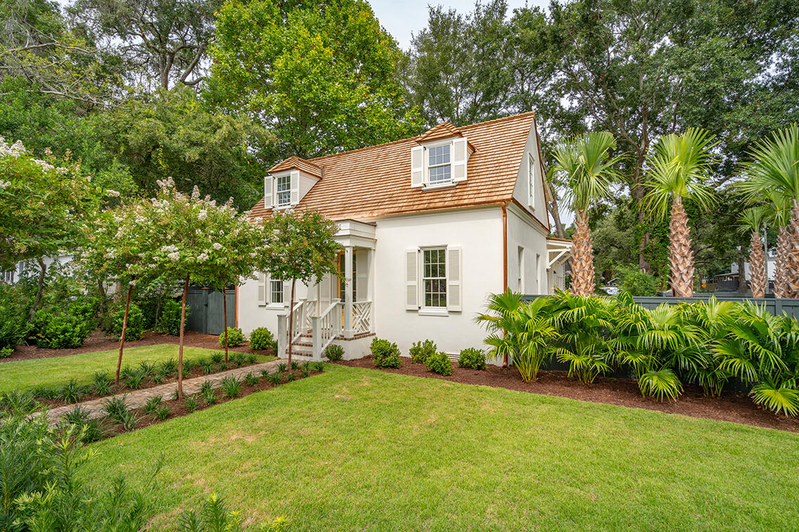 Custom designed home in Old Mount Pleasant within walking distance to all Old Village amenities. 686 McCants is a brilliant collaboration with Carlin Design Studio and Gray Wade Design creating a Lowcountry cottage with British Colonial flair. From its solid block construction coated with traditional stucco finish, louvered custom shutters, to it its cedar shake roof with copper accents, it's a true masterpiece in quality and workmanship. All of the home's surfaces and systems are completely brand new.The yard is extensively landscaped with specimen-sized trees and hedges, hand-moulded brick, shell stone patio and Cumberland stone drive. On the interior there is select, white, wide-plank character oak flooring. Upon entering, you appreciate the deep 12" outer walls trimmed in a handsome beaded Backband trim. The airy interior is thoughtfully designed in an open yet intimate arrangement. The kitchen's high-end appliances, including a LaCornue range, blend seamlessly with the custom cabinetry. Hand-cast hardware from England adds a thoughtful finishing detail. Throughout you will find custom light fixtures including lighting from Urban Electric and other top designers. The first floor includes entry, living, dining, kitchen, larder, mudroom rear entry, and a powder room with hand-blocked grass cloth wallpaper. Also on this floor, you will find the main bedroom suite complete with soaking tub, large shower, double vanity, separate water closet and a spacious walk-in closet. The second floor offers 3 bedrooms, each with their own character, sharing a bath with a large double vanity. The larger of the rooms has a storage closet but could also be outfitted by the new owner to have an en-suite bath if so desired. This home is the essence of Old Village living with details and finishes for the discerning buyer. Square footage provided by architect, please measure if important. X Flood Zone.