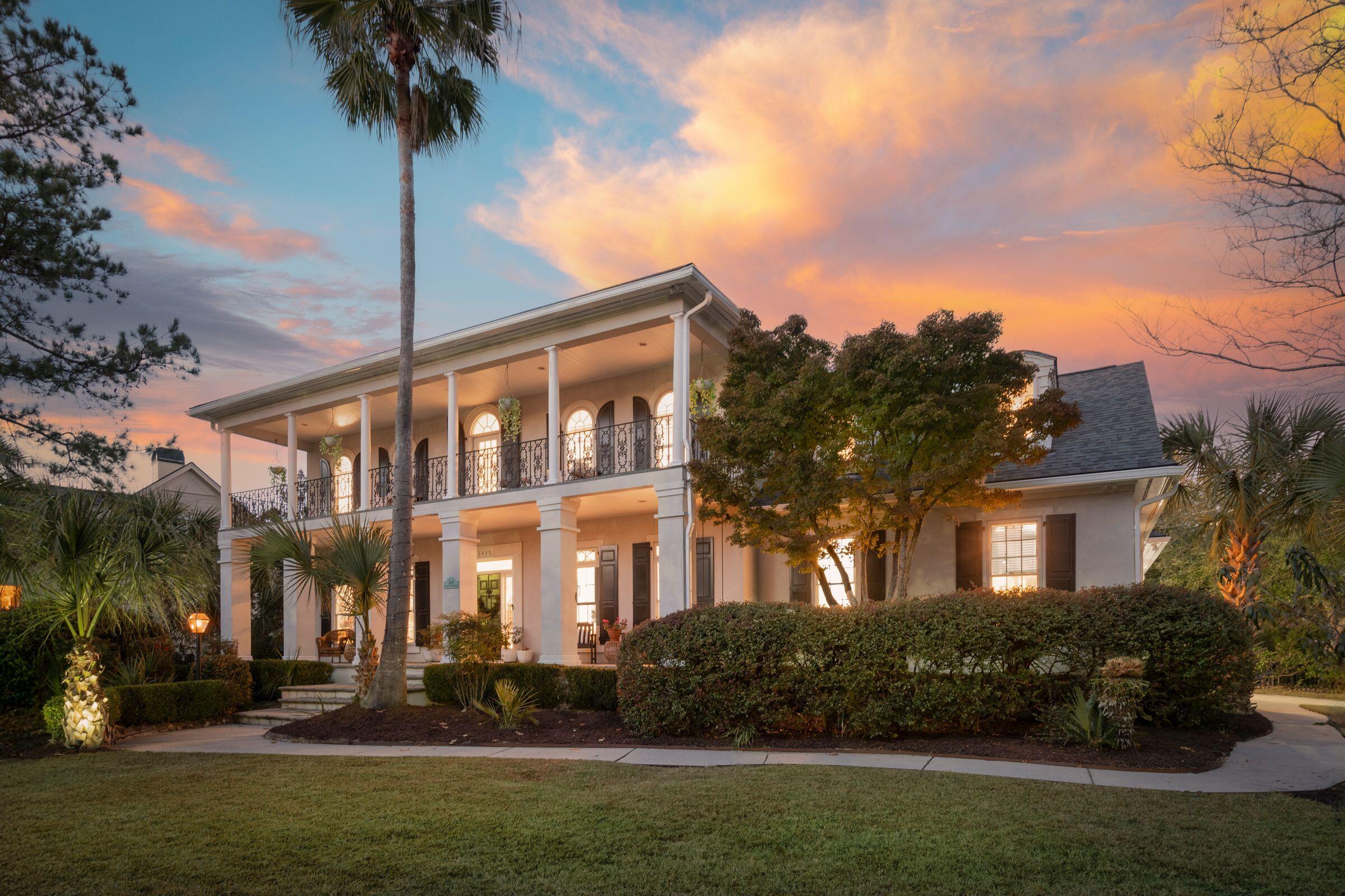 Discover unique Lowcountry living in this custom built home positioned on a picturesque corner lot surrounded by grand live oaks. The backyard is an entertainer's dream featuring a resort style retreat complete with sparkling pool, hot tub, fully equipped covered pavilion.   This luxurious outdoor spaces boasts a firepit, Bosch dishwasher, ice maker, refrigerator, sink and spacious seating area TV and outdoor Bathroom with separate shower for the ultimate convenience.  Bathed in natural light the interior offers 4735 Sq. Ft. of thoughtfully designed living space. This stunning home features a main living guest suite, formal dining room and a private office among it's  5 bedrooms and 3.5 baths. Hardwood floors add warmth throughout the main level where the open concept kitchen and familyroom provide seamless flow for everyday living or elegant entertaining. A practical mud room and storage area off the laundry room entrance enhance the home's functionality while dual staircases add architectural charm. The upper balcony tranquil views of the surrounding landscape. The primary suite is a sanctuary with a spa-inspired ensuite overlooking the cascading pool waterfall and outdoor oasis.  Two additional bedrooms, a second office or den and a versatile second family room or fifth bedroom complete the upper level ensuring space and comfort for all. Weather you are savoring the charm of Lowcountry porch living or enjoying your private backyard paradise, this home delivers the ultimate blend of sophistication and lifestyle.