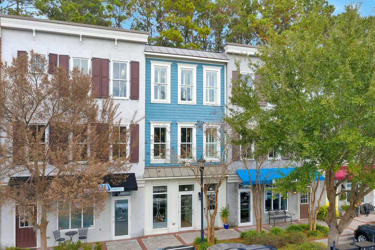 Located just 15 minutes from downtown Charleston and 10 minutes from the island beaches, this rare live/work condo in the highly desirable Shelmore Village offers an exceptional investment opportunity.  A walkable community, Shelmore offers convenient access to numerous restaurants, coffee shops, and more. This unit (#15) offers incredible visibility and accessibility for any business while providing a comfortable and spacious home above. Both the commercial and residential suites feature private entrances for maximum privacy and functionality. On the ground floor (Suite #102), you'll find a versatile commercial space, ideal for retail, office, or service-oriented businesses. Up one flight of stairs (Suite #202) is an upscale two-bedroom, two-and-a-half-bathroom condo with an open-conceptliving area, perfect for both relaxation and entertaining. Thoughtfully designed, this space features crown moldings, granite kitchen countertops, and hardwood flooring throughout the living areas. With the current tenants in place, this is an ideal opportunity for an investor seeking immediate rental income or a savvy buyer looking for a live/work space in one of Mount Pleasant's most desirable locations. ***Updated photos to come shortly***