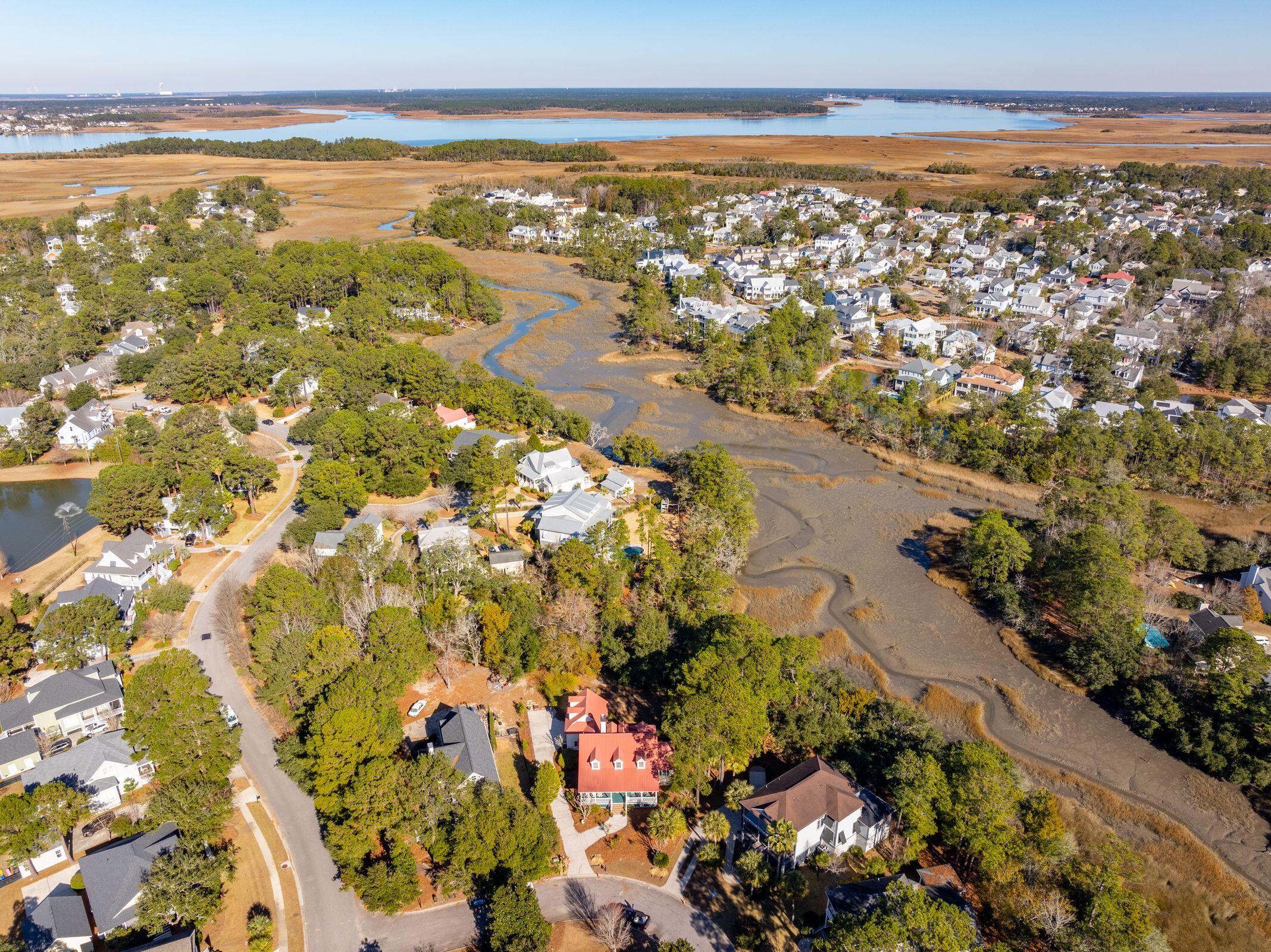 Welcome to 380 Tidal Reef Circle, nestled in the sought-after Grassy Creek neighborhood of Mount Pleasant, SC. This 4-bedroom, 3-bath Edisto River Cottage boasts timeless charm with its distinctive red, raised-seam roof and inviting low country aesthetic. Situated on a spacious 0.43-acre lot, this property offers serene marsh views and the promise of tranquil living with stunning natural surroundings.This home provides an exceptional canvas for creating your dream retreat. There are both front and back covered porches, ideal for enjoying the coastal breeze and scenic vistas. The expansive wooded backyard includes creek access, with the potential for a footbridge leading to a tidal creek that connects to the Wando River-perfect for small boats, kayaks, or paddleboards.With a 2-car garage complete with a finished room above, and ample outdoor space, this property is brimming with potential.
Grassy Creek is a peaceful and friendly community that embodies the essence of Lowcountry living.  Located just 10 miles from Downtown Charleston, this home provides easy access to the historic charm, dining, and entertainment of the city within a 20-25 minute drive. For beach enthusiasts, Isle of Palms is a quick 10-mile trip, while Sullivan's Island is just 8 miles away. Interstate 26 (I-26) is conveniently accessible 8 miles from the property, connecting you to the wider region with ease. Additionally, Mount Pleasant's vibrant dining scene, boutique shopping, and cultural attractions are just minutes from your doorstep, ensuring endless options for leisure and lifestyle activities.
Whether you're looking to renovate or start fresh, this property is a rare opportunity to own a piece of the Lowcountry with unbeatable marsh views, a fantastic location, and a unique architectural history. Don't miss out on the chance to create your own coastal sanctuary in this exceptional community. Schedule your showing today!