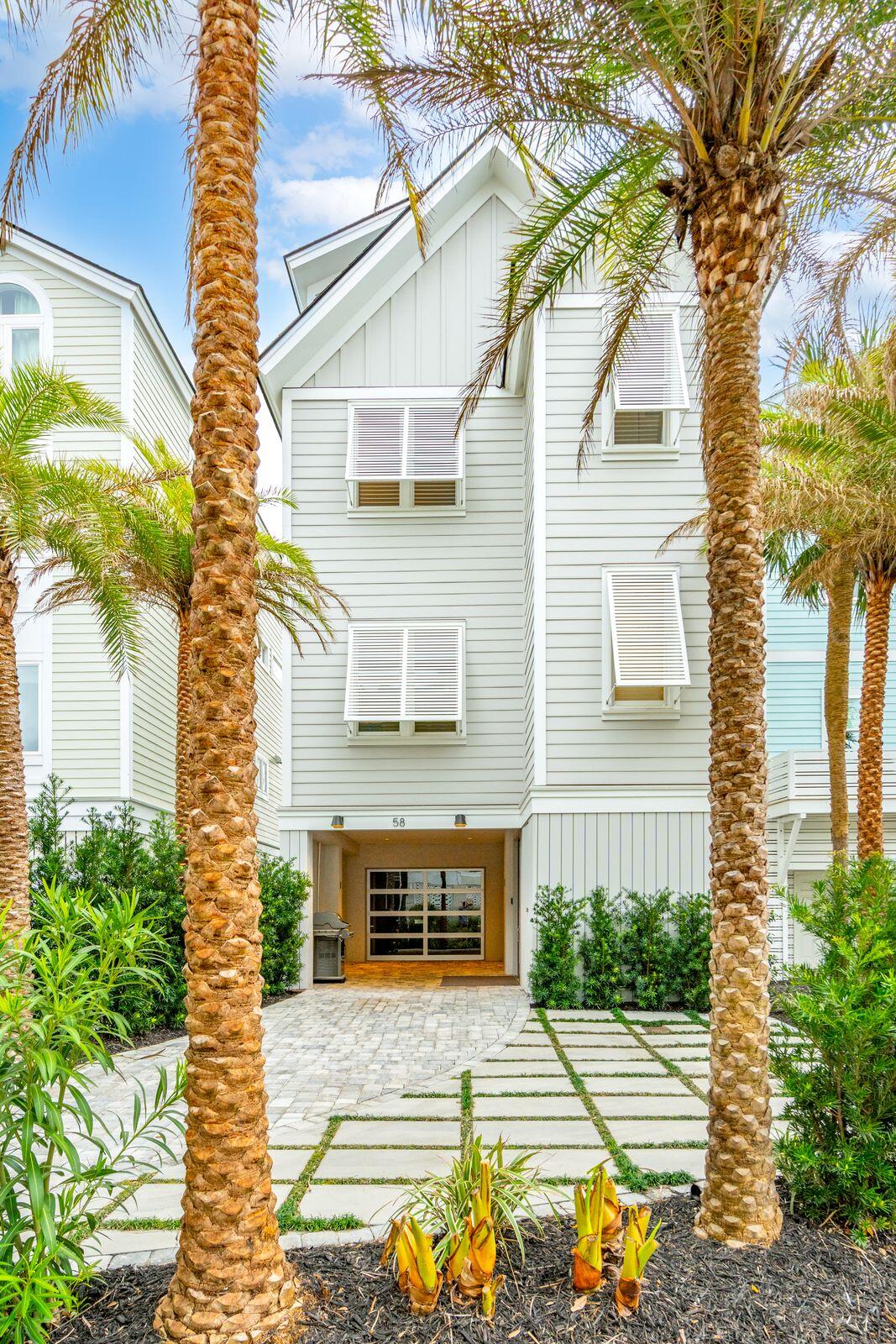 This fully furnished sought-after Wild Dunes community of Grand Pavilion, this spectacular oceanfront retreat sits mere steps from Isle of Palms's pristine beaches. Undergoing renovations completed in 2023, this home spreads across 3,900 square feet, three floors with six bedrooms, and five and a half bathrooms. Luxury imbues this property with high-end finishes and custom features throughout its modern design.  Whether hosting large-scale gatherings or more intimate dinners, the expertly crafted chef's kitchen showcases high-end appliances, a sleek wet bar, customized lighting, walnut cabinetry, and an expansive marble island with seating.A comfortable office or bedroom with a full bath and walk-in closet takes up the rest of the main living space and an additional powder room.

The first-floor balcony holds a chic plunge pool with temperature differentiation. Travel in style using the state of art glass elevator or floating glass staircase that transcends the different floors. Full-width accordion-style doors facing the beach adorn each of the home's three levels, showcasing the sea views and allowing copious amounts of natural light.

On the second floor, the primary suite offers an oasis within this Lowcountry retreat with extraordinary oceanfront views and a private balcony. The ensuite primary bathroom showcases a spa-like respite with dual vanities, a freestanding bathtub, and a customized walk-in closet. Two additional bedrooms complete the second level, each with ensuite bathrooms and high-quality finishings.

The third floor hosts a charming guest suite overlooking the home's front exterior for additional privacy. A spacious entertaining area makes up the rest of the floor, with a wet bar and beverage center, making hosting guests on the relaxing sun deck easy. Perfect for morning coffee or sunset cocktails.

The value of this magnificent property astounds with all 8' solid custom interior doors, IPE deck, and stainless steel railing on all levels, as well as all white oak flooring throughout. A commercial-grade sprinkler system protects the entire home for added peace of mind. With a new roof, windows, and doors and top-of-the-line hurricane protection, this property remains affordable to insure and simple to maintain.

Experience the best of coastal living on the Isle of Palms with this stunning oceanfront retreat, just a short 40-minute drive from the vibrant heart of downtown Charleston. Simply pack your bags and personal belongingsyour new home awaits, ready for you to move right in!