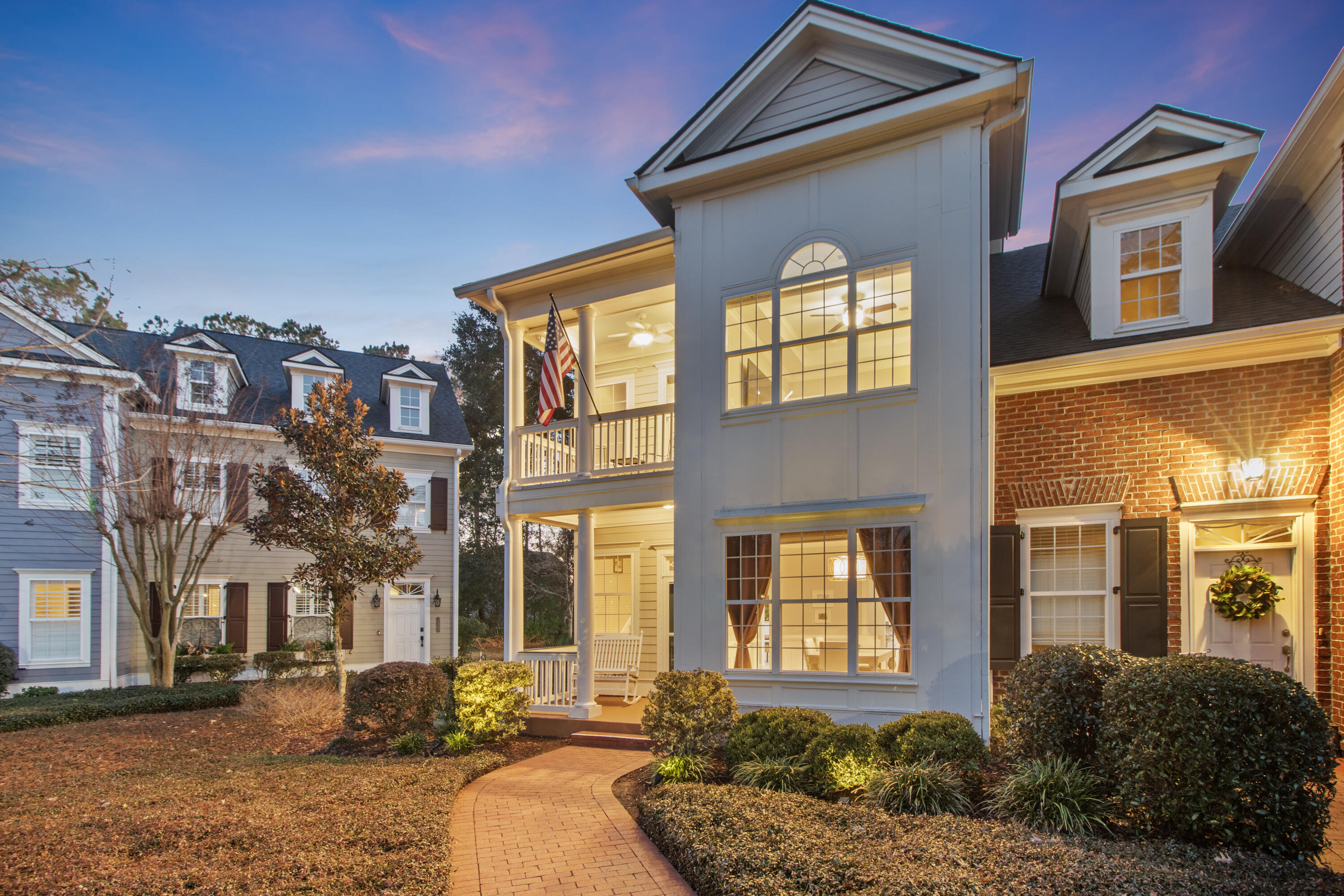 Tennyson Row end units like this one with double front porches, brick walkways, fenced paver courtyards with grand live oak views, and 2-car detached garages don't come along very often and this one is sure to charm from the start. Soaring 10-ft ceilings, loads of natural light, open concept living space, a kitchen built for entertaining, spacious bedrooms, new Samsung Bespoke appliances, and stylish new lighting are just a few details to note. Snuggle up by the gas fireplace, relax in one of the three outdoor living spaces, enjoy the many Park West amenities, or take advantage of the Mt. Pleasant Recreation Department Complex and Laurel Hill County Park access within the neighborhood. More details include:* Roof of home and on detached garage was replaced recently by the Tennyson Row HOA, the HVAC is only 3 years old, there is a new garbage disposal, and new Samsung Bespoke appliances with interchangeable glass panels that offer a way to change the look of your appliances without buying new appliances.

* Park West's amenities include two pools, lighted tennis courts, a beach volleyball court, an awesome play park, a large club house, a picnic pavilion with grills, a crabbing dock, and gated boat storage (for an extra fee).

* Residents of Tennyson Row enjoy the convenience of living in a townhome community with a condo association that manages exterior and routine landscape maintenance, landscape maintenance (mowing, trimming, weeding, tree maintenance, and mulching), gutter cleaning, termite prevention and pest control, and studs-out insurance. Parking is also ideal. In addition to a detached 2-car garage, residents and guests are free to utilize the front gravel parking pads as well, which offer a number of additional parking spaces.

* Residents of Park West also enjoy convenient access to the 745-acre Laurel Hill County Park with its miles of walk/bike/hike trails AND the sports/recreations areas at Mt. Pleasant Recreation Department's Park West Recreation Complex, both of which are accessible through Park West. The Park West Recreation Complex features a variety of sports fields (soccer, baseball, softball, lacrosse, and football), an outdoor track, a gymnasium, tennis courts, batting cages, a natatorium, and a dog park.

* Additional conveniences available to Park West residents without leaving the neighborhood include, but are not limited to, groceries, lots of restaurants, daycare providers, medical offices, banking, fitness centers, gas, etc.

* Isle of Palms beach is 10 miles away, Boone Hall Plantation is only 5 miles away, Shem Creek is just 11 miles away, and Downtown Charleston is a quick 15 miles away.

This one is too good to miss! Book your showing today!!