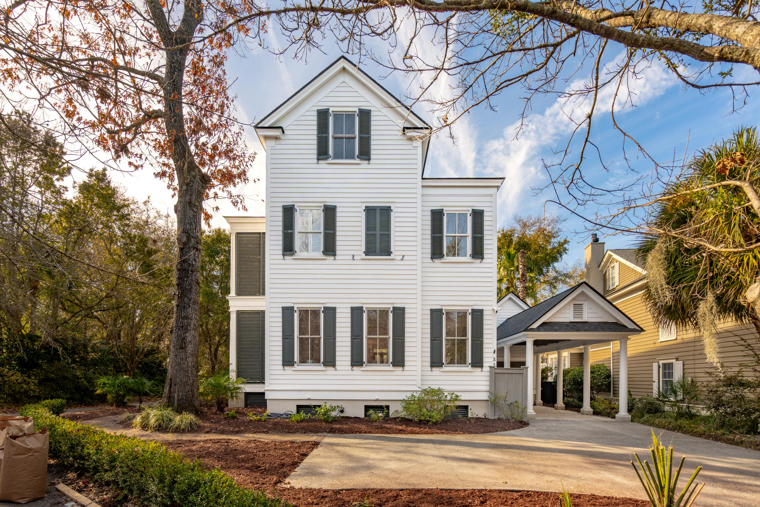 Located in Mount Pleasant's award-winning I'On neighborhood, this impeccable home offers classic Charleston style on the exterior and an open modern floor plan on the interior. 31 Frogmore Road exudes southern charm with double front porches and a second-floor wraparound porch. The backyard retreat features a saltwater pool that can be heated or cooled as well as a pool house with a half bath and a shower. The property is situated on the marsh which provides privacy as well as easy access to the neighborhood's scenic walking path. This home is perfect for entertaining with the first floor containing a beautiful chef's kitchen showcasing a brand-new Viking gas cooktop and spacious family room. On the second floor, you'll find the expansive primary suite with double closets and a recently renovated bathroom. There are two additional en suite bedrooms and baths on this level. The third floor offers a full bathroom and two additional rooms; one is currently used as a bedroom, and another is used as a combination exercise room. 31 Frogmore Road is move-in ready and has had extensive updates and renovations.