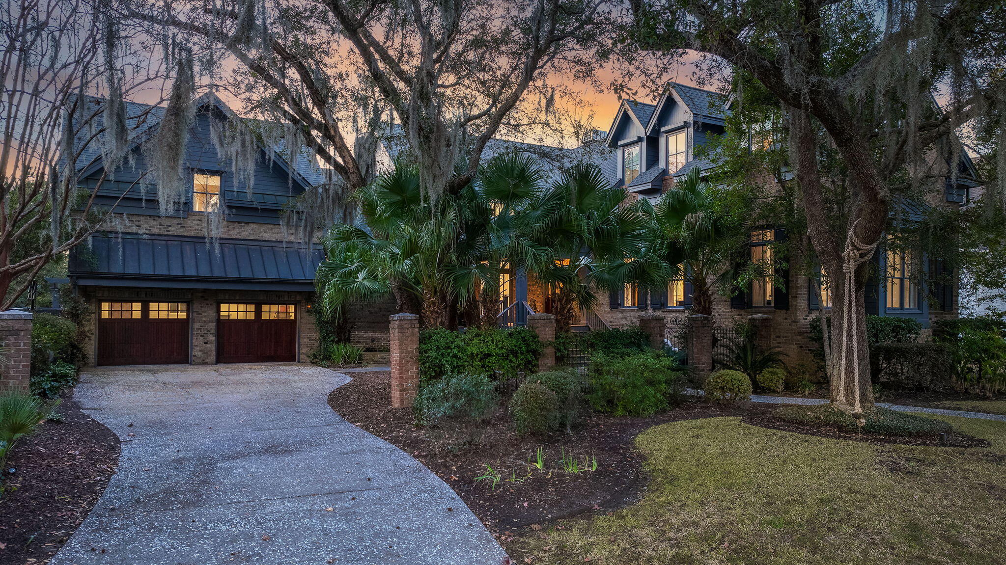 Welcome to this luxurious island retreat, perfectly situated on a quiet, sought-after street in Watroo Point. Overlooking the 16th fairway of the Beresford Creek Course at the prestigious Daniel Island Club, this custom-built home offers full golf membership availability, allowing you to enjoy world-class golfing right away. The estate is framed by professionally landscaped grounds, featuring majestic Southern live oaks that enhance both the front and back yards with timeless Lowcountry charm.Recently renovated to perfection, this home exudes style and sophistication. The open-concept design seamlessly connects the kitchen, dining room, and living room, all highlighted by soaring ceilings and rich red oak hardwood floors throughout.At the heart of the home, the gourmet kitchen boasts top-of-the-line Miele appliances, custom birch cabinetry, and a striking marble island - brand new and ready for entertaining.

The spacious first-floor primary suite is a true sanctuary, featuring a 12-foot ceiling and a spa-inspired master bath adorned with mosaic marble tiles and designer fixtures. Adjacent to the suite, a cozy private office provides a quiet retreat for work or study. Thoughtful details continue with two laundry rooms - one on each level - complete with a pet spa for added convenience.

Upstairs, the home offers two distinct wings. One wing features two generous bedroom suites, each with ample closet space, built-ins, and private en-suite baths. Step onto the balcony from this level to take in sweeping golf course and sunset views. The opposite wing includes a serene guest suite, a dedicated yoga/exercise room, and a peaceful relaxation parlor - perfect for unwinding.

For even more flexibility, the fifth bedroom sits above the garage and comes complete with its own kitchen, private bath, and abundant storage. Connected to the main house, this versatile space is ideal for visiting guests, a children's bunk room, or a recreation area.

Every detail of this home has been thoughtfully designed to create a warm yet refined atmosphere, with top-tier finishes reflecting a true commitment to quality. Whether you're hitting the links, enjoying the nearby club and athletic facilities, or simply soaking in breathtaking backyard sunsets, this exceptional island home offers the ultimate Lowcountry lifestyle.