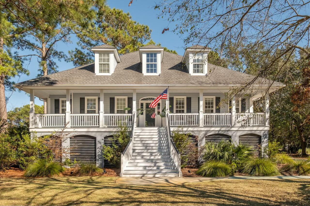 Welcome to this beautifully crafted custom elevated home in the desirable Hamlin Plantation community of Mount Pleasant, SC. This 4-bedroom, 2.5-bath home blends luxurious finishes with functional design. The owner's suite is conveniently located on the main level, offering a private retreat with a spa-like bath featuring a jetted tub, dual vanities, and an expansive walk-in closet.As you walk into home, you will find a formal dining room, large great room and nicely appointed kitchen with white cabinetry. The main floor boasts Brazilian cherry floors throughout, creating a warm and inviting atmosphere. A stylish powder room is also conveniently located on the main level. Enjoy seamless indoor-outdoor living in the sun-drenched 4-season room, perfect for year-round enjoyment. Also on main level you will find the spacious office offers a quiet retreat for work or study, don't miss the gorgeous views!
Upstairs, you'll find three generously sized bedrooms and a well-appointed full bath.  The elevated design includes ample garage space for parking and storage, along with an exercise room or flex room.
Hamlin Plantation offers a wealth of amenities, including a community pool, tennis courts, and scenic walking trails. This exquisite home provides the perfect blend of comfort and luxury in a vibrant,  highly sought-after neighborhood. Don't miss your chance to own this one-of-a-kind gem!