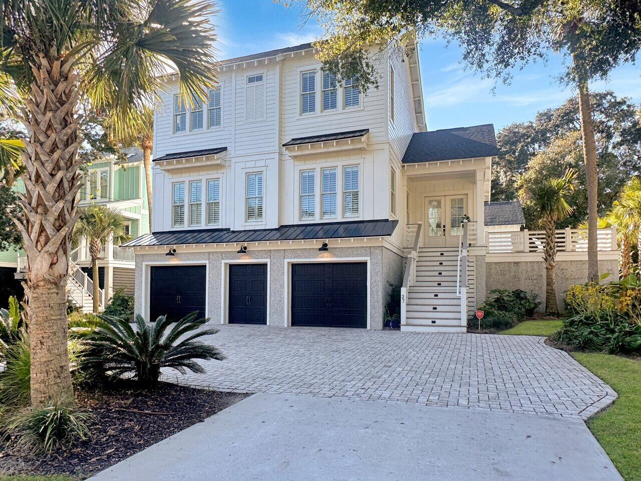 Where relaxed island living meets true luxury! This stunning fully furnished custom home on Isle of Palms offers the perfect blend of elegance and comfort. Situated on a spacious 0.33-acre lot, this solidly built 6-bedroom retreat is bathed in natural light and designed for effortless coastal living.Step inside to an open floor plan with soaring ceilings, rich hardwood floors, elegant shiplap accents, and high-end finishes throughout--a true testament to thoughtful craftsmanship. The gourmet kitchen is a chef's dream, seamlessly opening to an outdoor lounge with a TV, grilling station, and breathtaking views of the heated saltwater pool--an entertainer's paradise!On the main level, the luxurious primary suite offers a private retreat with a spacious walk-in closet, a soaking tub,and a separate spa-like shower. An additional guest suite with an en suite bath and a full poolside bath provide extra convenience.
Upstairs, you'll find four more spacious bedrooms, each with its own private bath, ensuring privacy and comfort for all. The bunk room is a fun and cozy space the whole family will love!

For those who need storage and space, the oversized garage features two roll-up doors plus an additional garage door for your golf cart, making beach living effortless. And yesit even has an elevator for added convenience.

This home truly embodies coastal luxury, with every detail thoughtfully designed for the ultimate island lifestyle. Schedule your private tour today and experience this one-of-a-kind retreat!