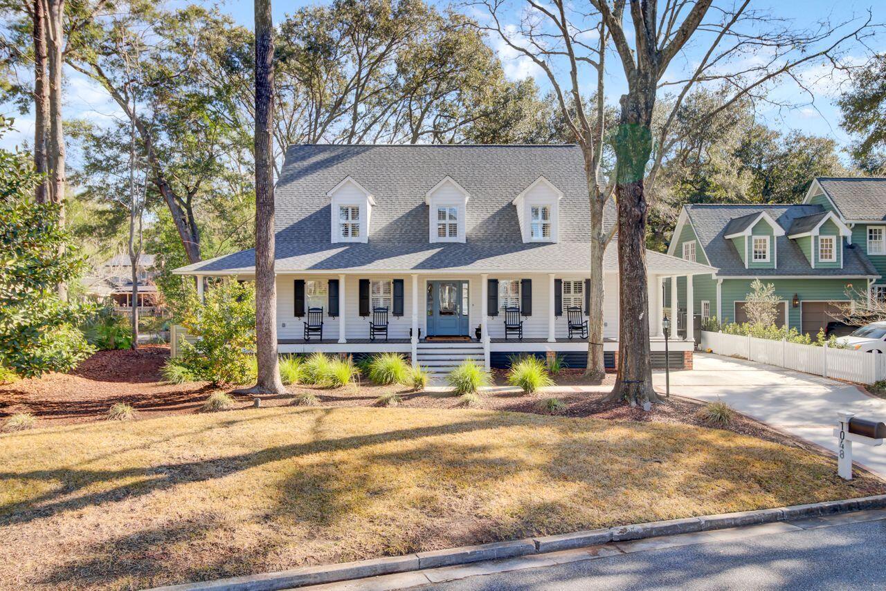 Rare and Thoroughly Charming opportunity to own in Wharf Indigo!   Even before you step inside this home, you'll fall in love with the Classic Lowcountry design elements.   The wraparound porch provides endless opportunities and space for relaxing or rocking in your favorite chair, and the dormers, new roof, and mature trees add amazing curb appeal.  The inside boasts of heart pine floors, updated kitchen and bathrooms, ship-lap accent walls and ceilings and so much more!  The Great room, with its vaulted ceilings, is the center of the home. Its layout is perfect for entertaining and flows seamlessly between the living areas.  The dining room with dramatic ship-lap vaulted ceiling overlooks the backyard.  The gourmet kitchen has ample storage and includes stainless appliances, quartzcounters, tile backsplash and a large center island.   The laundry is located off the kitchen but also has access from the front porch so it's an ideal location for a "drop zone" as you come inside.  The Master bedroom is located on the main level and has access to a small separate deck - the perfect spot for a cup of coffee or early evening drink.   The Master Bath has been recently updated with claw foot tub and HUGE tiled shower.    Upstairs you'll find 3 well appointed bedrooms.  One has an ensuite with recently updated bathroom and the other 2 bedrooms share a "jack and jill" bath, also recently updated.  Outside, you'll find a large deck wrapped around a gorgeous Oak tree providing an impressive backdrop for this low country oasis.  A brick patio is the perfect spot for a fire pit, and the rear ivy-draped fence and new side yard wood fencing provide privacy.  A large storage shed with power offers plenty of storage space or a workshop.  The driveway was also recently redone with a brick surround so plenty of parking for vehicles and/or a golf cart.   *Wharf Indigo is a small neighborhood of 17 homes at the end of Dragoon Drive -- tucked in between Creekside and Cooper Estates.   There is a pedestrian bridge at the end of Wharf Indigo that connects to Pawley Drive in Cooper Estates allowing for easy access to Shem creek.  Just over mile walk, bike or golf cart ride to Shem Creek!

This home is a true gem, blending classic Lowcountry design with modern updates and a PRIME location in South Mount Pleasant.   Schedule a showing today -you won't be disappointed.