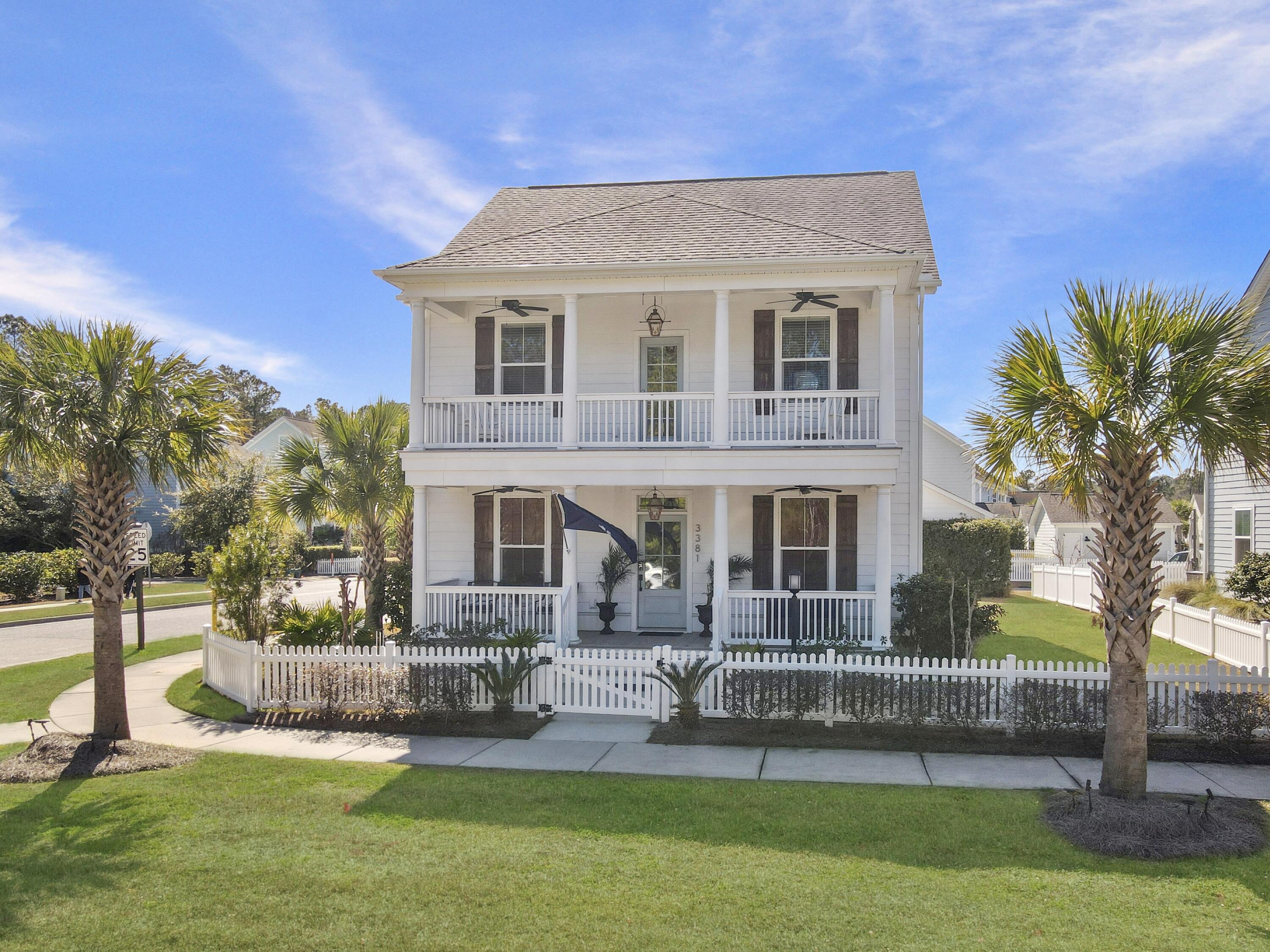 Welcome to 3381 Stockdale St., a beautifully appointed three-story home in the highly sought-after Abbey subsection of Park West in Mount Pleasant. This charming four-bedroom, 2.5-bath residence exudes classic Southern elegance, featuring double front porches and a picturesque white picket fence. Situated on a spacious corner lot, one of the largest in The Abbey, this meticulously maintained home offers abundant outdoor space for gatherings with family and friends. Step inside to an open-concept floor plan that seamlessly blends traditional charm with modern design.The inviting living area boasts a stunning gas fireplace accented with shiplap, adding warmth and character to the space. A detached two-car garage provides additional storage and parking, while the home's prime location offers unmatched convenience. Within walking distance, you'll find Roper Hospital, major retailers like Costco and Publix, and a variety of local restaurants. Residents of Park West also enjoy access to Laurel Hill County Park and the Mount Pleasant Rec Center, featuring miles of walking and jogging trails, a community pool, and a state-of-the-art amenity center. All of this is just 15 minutes from the pristine beaches of Isle of Palms and Sullivan's Island and only 20 minutes from historic downtown Charleston. Don't miss your chance to own a stunning home in one of Mount Pleasant's most desirable communities. Schedule your private showing today!