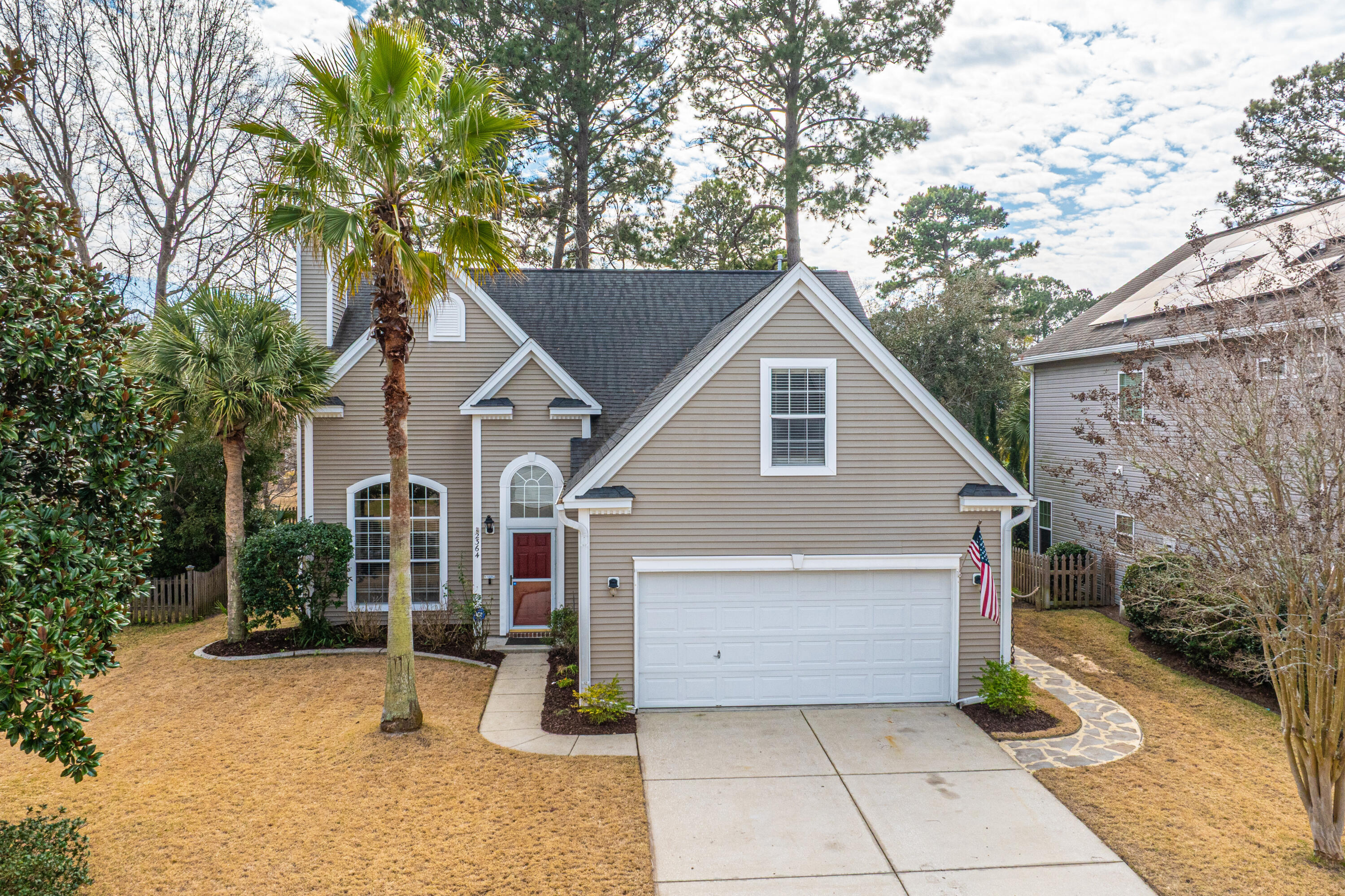 I am pleased to offer 2364 Parsonage Woods Lane now for sale in sought after Park West. When approaching, you are welcomed to mature landscaping with Palm Trees, Crepe Myrtles, Azaleas and sidewalk lined streets! Upon entering this home, you are greeted to a two-story vaulted family room with a wood burning fireplace, a ceiling fan and many windows for an abundance of natural sunlight. Beyond the family room sits the Separate Dining Room (or a great office space) which is immediately to the left of the oversized eat-in kitchen featuring Granite Counters, Hardwood Floors, Stainless Steel appliances, Tons of 42'' Solid Wood Cabinets, a Center Island, and a very large Breakfast Area surrounded by an numerous windows. The Kitchen leads to a Screen Porch offering a ceramic tiled floor thatoverlooks a very scenic backyard with a lovely Pond view.  This nice outdoor space is great for entertaining and enjoying quiet evenings in the outdoor 6 Person Hot Tub that will convey. Back inside, you will find the first-floor primary suite which has a garden tub, separate shower, dual vanities, and walk in closet.  Proceed upstairs to the 3 additional bedrooms, a large guest full bathroom with dual vanities and a bonus room that is considered as the 5th bedroom with a large walk-in closet.  The Laundry Room is located downstairs and leads out to a 2-car garage. Park West is a sought-after neighborhood with phenomenal amenities including 2 pools (Jr. Olympic and a Zero Entry Pool), Tennis Courts, Playground, Clubhouse, the Park West Crab Dock/Fishing Pier and MILES of walking and jogging trails. The Town of Mt. Pleasant Recreation Center is conveniently located within the Park West Community offering an indoor pool, soccer, baseball and football fields.  In addition to all of this, 2364 Parsonage Woods Lane is zoned for Award Winning Schools and is conveniently located just a short drive to the beaches, Roper St. Francis Hospital, Restaurants, Retail Stores, Professional Services, Grocery, Costco, Trader Joes, Park West Vet and much more.