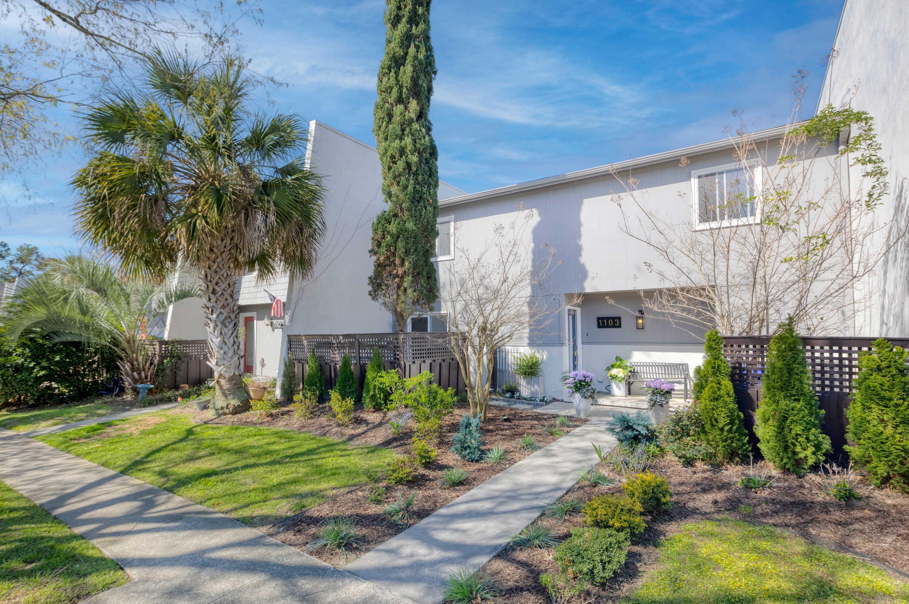 Impeccable one-of-a-kind renovation in coveted Snee Farm! 1103 Ventura Place has been meticulously designed with custom finishes from floor to ceiling that will surely impress the most discerning of buyers- only minutes from gorgeous Isle of Palms and everything Mount Pleasant has to offer.At over 2400 sqft, this sprawling townhome offers unmatched livability with an open concept layout, high ceilings, and hand scraped vinyl plank flooring . The fully redesigned kitchen boasts bespoke cabinetry with coordinating paneled appliance package, impermeable porcelain countertops, custom range hood and gourmet induction oven. Enjoy morning coffee at the oversized island or entertain dinner guests in the dedicated dining space.Drenched in natural light, the stunning living room showcases cathedral ceilings and an effortlessly elegant wood-burning fireplace. The first floor features a versatile den complete with a renovated full ensuite bath- perfect to use as a 4th bedroom, mother-in law suite, or home office. This color drenched space also offers a wet bar, built-ins, and exterior access to the newly tiled backyard patio. 

Upstairs you'll find respite in the expansive owner's retreat. The primary suite features an adjoining dressing room/walk-in closet (complete with vaulted ceiling) and beautiful ensuite bath. Step inside this spa-like haven to sophisticated lighting, luxury tile, and free standing soaking tub. Down the hall you'll find yet another standout feature: a custom bunk room integrating both style and function. A third renovated full bath and an additional guest room round out the second floor. 

Abutting the Snee Farm CC golf course, the back patio has been completely transformed into an idyllic oasis with an ample sized fenced astroturf yard and 3 hole putting green! Other outdoor highlights include an aptly sized storage closet/workshop and gated courtyard style front patio. 

Ventura Villas offers residents a private pool, tennis/pickleball courts, clubhouse, boat storage, exterior maintenance and landscaping- truly making this home the perfect lock-and-leave residence.