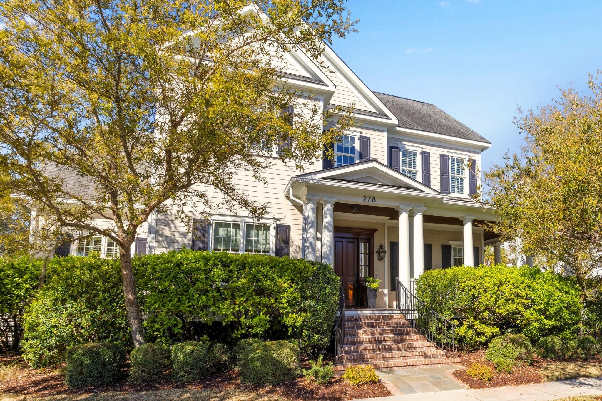 Welcome to 278 Furman Farm Place, a distinguished Southern-style estate with a FULL GOLF MEMBERSHIP(no 8-year waitlist)! Thoughtfully designed with timeless craftsmanship, this custom-built home by Bob Lee boasts exquisite architectural details and an inviting layout perfect for both everyday living and entertaining. From its wraparound porches to the detached FROG, every element of this home reflects quality and elegance.Step inside to a grand two-story foyer, where oak hardwood floors, a graceful wrapping staircase, and eleven-foot ceilings set the tone for the home's warm sophistication. To the left, a formal office with rich paneling and a coffered ceiling offers a refined workspace, enclosed by French mahogany doors for privacy. The light-filled living room, anchored by a striking gas fireplace with custom built-ins, seamlessly flows into the open-concept kitchen. Large glass doors lead to the screened porch, bringing in natural light and a connection to the outdoors. Lush landscape and glimpses of the Ralston Creek marshes are your outdoor backdrop as you keep cool on the covered porch. Modern ceiling fans and gorgeous stained beadboard ceilings add a nice touch the the home's exterior.

The chef's kitchen is as functional as it is beautiful, featuring a Wolf range, ample counter space, and a Bosch dishwasher for effortless cleanup. Guests can dine casually at the island, at the breakfast table, on the covered porch, or in the formal dining room. Adjacent to the dining space, a stylish wet bar with a bar sink, glass cabinetry, and dual beverage centers enhance the home's entertaining potential. Whether hosting a dinner party or enjoying a quiet morning coffee, this home caters to every lifestyle. A nearby powder is provided in the main hall for convenience.

Designed for convenience, the first-floor owner's suite is a serene retreat. Spacious and sunlit, it features direct access to the covered porch and a spa-like en suite bath with a large glass shower, body sprays, dual vanities, and a freestanding tub. A custom walk-in closet with a center island and built-in organization adds a touch of luxury. Nearby, a well-appointed laundry room with a utility sink and a versatile second office spaceperfect for a walk-in pantry, homework room, or mudroomcompletes the main level.

Upstairs, a large media/flex room provides endless possibilities, whether as a movie room, play area, or hobby space. A built-in wet bar with cabinetry adds convenience, while two easily accessible unfinished attic spaces offer abundant storage. (Should it be needed or desired, one of the unfinished spaces could be turned into an additional bedroom). A nearby powder room services this section of the home. Down the hall, two spacious bedrooms each feature custom closets and en suite bathrooms, making them ideal for guests or family members.

A standout feature of this home is the detached FROG, accessible via a covered walkway. This private space offers a main living area, a compact bar with a sink and mini fridge, walk-in closet, and a full bathroomideal for long-term guests, live-in help, a home gym, or a private retreat. Below the FROG, a two-car garage provides additional storage and functionality.

278 Furman Farm Place presents a rare opportunity to own a meticulously crafted Parkside home in a tranquil street. With its timeless design, high-end finishes, and flexible living spaces, this home effortlessly balances elegance and practicality, making it a truly exceptional find.

*Buyer to pay a one-time neighborhood enhancement fee of 0.5% of the sales price to the Daniel Island Community Fund at closing, along with an estoppel fee to the Daniel Island Property Owners Association, Inc. Buyer/buyer's agent to verify all information deemed important, including flood zone, school zone, square footage, and acreage.