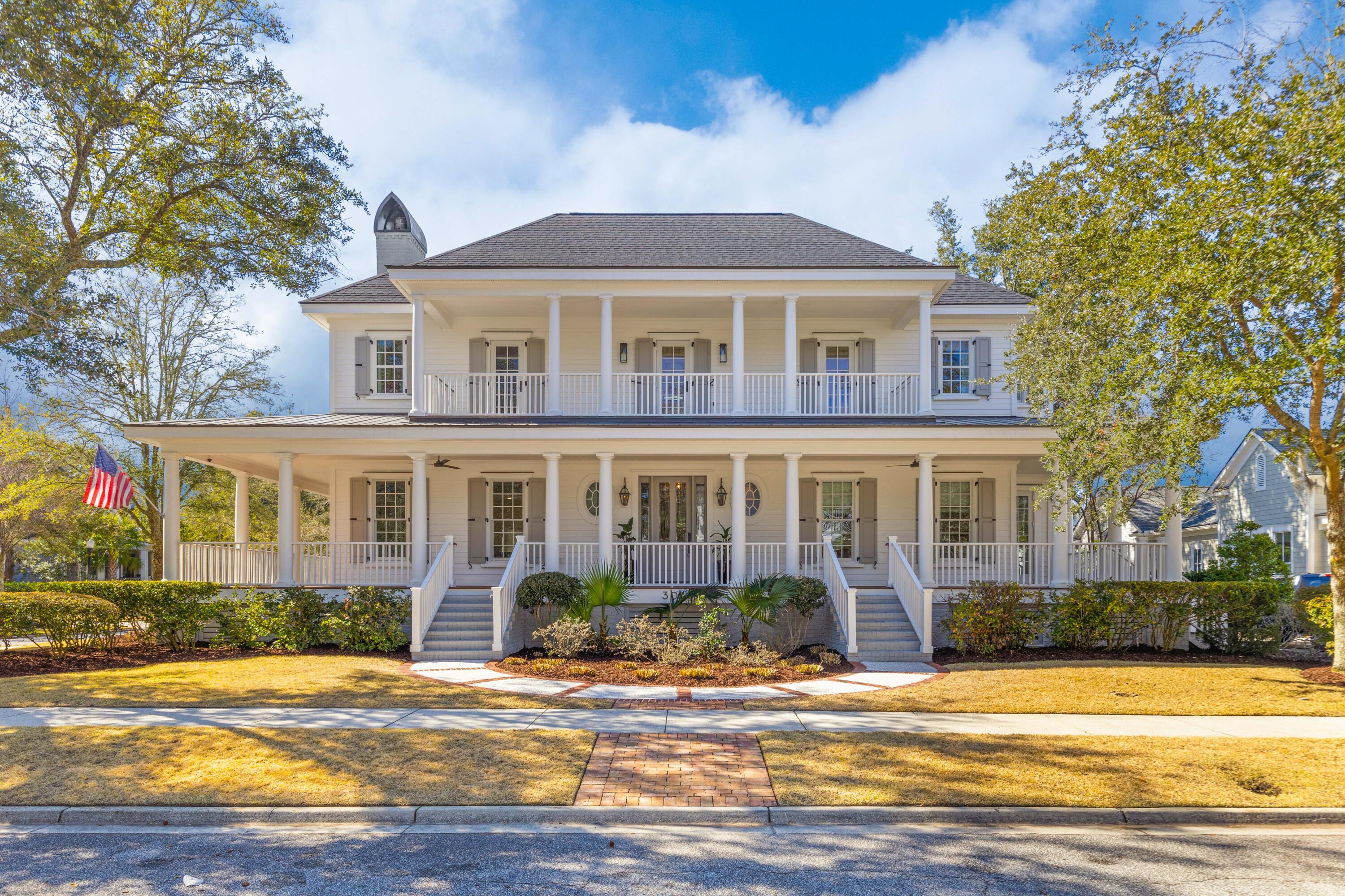 Experience the Essence of Southern Living at 301 Hidden Bottom Lane! Nestled in the coveted Daniel Island Park, this stunning corner-lot home embodies coastal charm and modern elegance. Recently renovated inside and out, it's the perfect retreat for a bustling family or those who love to entertain. Boasting five bedrooms plus a guest room, 5 1/2 baths, and sophisticated design throughout, this home offers a seamless blend of style and functionality. Step onto the expansive wrap-around porch, where flickering gas lanterns set the scene for serene summer evenings. Inside, you'll fall in love with the grandness of the home with gleaming white oak floors, 12 foot ceilings and beautiful trim details. Natural light pours in from multiple directions, while access to the front, side, andscreened-in porch provides a seamless indoor-outdoor lifestyle. The dining area opens to the screened porch, complete with a large gas fireplace, that overlooks a beautifully landscaped backyard giving the perfect private hideaway.

The kitchen is designed for both culinary excellence and effortless entertaining, the kitchen features: custom cabinetry, sandstone leathered countertops, Wolf six-burner Wolf gas range and microwave, Bosch dishwasher, and a farmhouse sink. The wet bar includes additional storage including a prep sink and wine cooler. Enjoy counter seating or the many options for an expansive dining table and lounge seating area nearby.

With 12-foot coffered ceilings, the elegant and spacious great room is the perfect retreat with a custom gas fireplace and designer lighting. The private hallway leads to the primary bedroom which is a sunlit sanctuary, offering backyard access and abundant storage, including a custom walk-in closet for both him and her. The en suite bath features polished porcelain floors, dual custom vanities with Borghini Gold quartz countertops, glass-enclosed marble shower and a freestanding soaking tub

A conveniently located powder room and coat closet complete the inviting entry hall. A chic office with custom paneling and a full-sized Murphy bed offers flexibility, with a full bath just steps away for guests. Two additional spacious bedrooms each feature custom closets, private en suites, and stylishly updated bathrooms with playful tile, bespoke cabinetry, and modern lighting. The front bedroom offers access to a private second-story porch with picturesque neighborhood views. 

Just a few steps up, there is a large hallway that can serve as an additional office or homework area. Two additional shiplap adorned bedrooms and a full bath are on this floor, along with a spacious storage closet. There is a generously sized attic offering options for adding square footage if needed.

The home also features a unique lower level just off the entryway, the renovated mudroom and laundry room provide flexibility and convenience, there is plenty of space for a playroom or home gym. This space includes a washer and dryer, custom cubbies, and direct access to the backyard. The freshly painted detached two-car garage provides ample storage.

From its elevated finishes to its seamless blend of classic charm and modern luxury, 301 Hidden Bottom Lane is a rare gem in the heart of Daniel Island Park. Don't miss this exceptional opportunity to call it home!


NO FLOOD INSURANCE REQUIRED. Please contact the Daniel Island Club for all club details and available optional golf memberships. Buyer to pay a one-time neighborhood enhancement fee of .5% x sales price to Daniel Island Community Fund at closing and an estoppel fee to the Daniel Island Property Owners Association, Inc. Buyer/buyer's agent to verify anything deemed important such as square footage, flood zone, club memberships, school zone, etc.