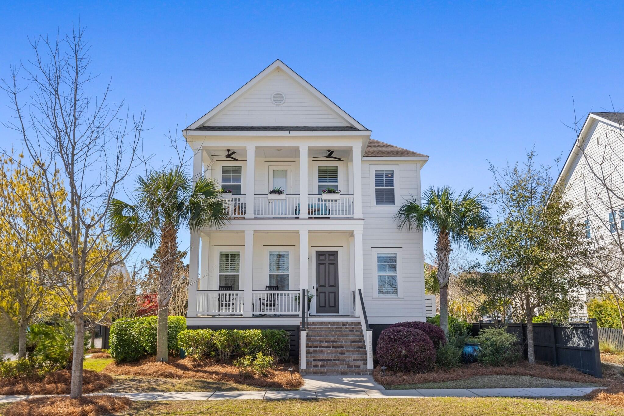 Welcome to 1555 Willtown, a stunning Lowcountry retreat nestled in the heart of Daniel Island. This beautifully appointed 4 bed, 3.5 bath home offers a rare combination of charm, modern upgrades, and sought-after amenities--including a private pool, detached FROG, upgraded kitchen, and picturesque park views.The charming exterior captivates with its crisp white facade, manicured landscaping, double porches, and classic Southern-style railings adorned with flower boxes. Step inside to be greeted by gleaming wood floors and a preview of the home's inviting living spaces. To your left, a formal office provides a quiet and stylish workspace. The bright, coastal-inspired living room features a custom gas fireplace with accented tile and shiplap, creating a cozy yet refined atmosphere.The renovated kitchen is a chef's dream, showcasing an oversized island, quartz countertops, a herringbone backsplash, and premium finishes. A built-in breakfast bench with a custom leather cushion adds both charm and functionality.

Step outside to discover your own private oasis. A spacious screened porchcomplete with modern ceiling fansoffers a cool escape from the Lowcountry sun, while the outdoor fireplace sets the stage for cozy gatherings on crisp evenings. Just beyond, the sparkling pool invites you to unwind, whether you're hosting a lively summer barbecue, enjoying a quiet morning swim, or soaking up the sun on a lounger. The adjacent patio features a built-in grilling station with a Green Egg and fridge, ensuring effortless al fresco dining.

The outdoor fun doesn't stop therethe pool area is designed for making lasting memories. Imagine birthday celebrations where little ones enjoy ice cream at the picnic table, teens gather around the fire pit, or adults relax in style with a drink in hand. The patio also provides easy access to the detached FROG, a versatile space complete with a living area, bedroom setup, full bath, and potential for a formal kitchenetteideal for guests, in-laws, or even a private home office.

On the second floor, you'll find the tranquil owner's suite. This spacious retreat features a designer light fixture, multiple windows, a walk-in closet, and an en suite bath with a glass shower and dual sink vanity. Down the hall, the conveniently located laundry room sits between two guest bedrooms, each offering ample closet space. The front bedroom enjoys direct access to the balconya perfect nook for curling up with a good book while taking in the peaceful park views. A full bathroom in the main hall completes the second floor.

1555 Willtown is a true gem, offering a blend of interior upgrades, outdoor entertainment spaces, and timeless Southern charm. Nearby community parks, pools, playgrounds, a library, and schools create a wonderful environment. A short golf cart ride away is the ever-popular Credit One Stadium where top musicians and renowned tennis tournaments take place. There is so much to love about life on Daniel Island. Don't miss your chance to make it your new home! 

*Buyer pays a one-time neighborhood enhancement fee of .5% x sales price to Daniel Island Community Fund at closing. Buyer/buyer's agent to confirm any information deemed important, such as school zone, flood zone, square footage, acreage, etc.