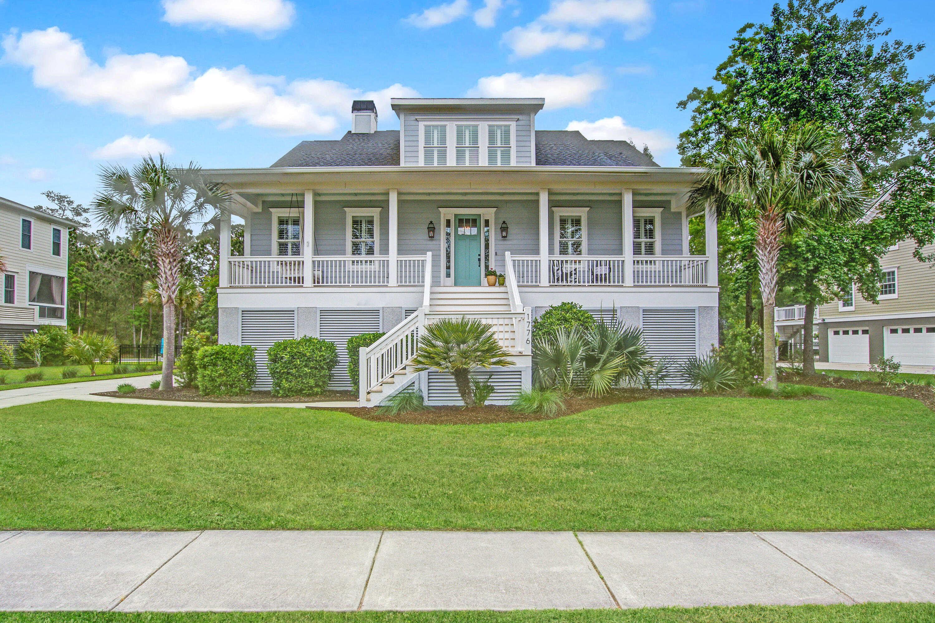 Tucked on a beautifully maintained 0.31-acre lot, this elevated Lowcountry home offers over 3,000 square feet of timeless style. With 4 spacious bedrooms, a 3-car garage, and custom finishes throughout, every inch of this home has been thoughtfully designed to blend comfort and function with effortless Southern charm.From the moment you step inside, rich wood floors, soaring 10-foot ceilings, and plantation shutters set the tone for a home that feels both elevated and welcoming. The formal dining room features tray ceilings, crown molding, and wainscoting that lead seamlessly into a beautifully appointed kitchen. Granite countertops, stainless steel appliances, a farmhouse sink, a central island, and ample cabinetry make this kitchen a dream for both everyday living and entertaining.A sunny eat-in area and access to the screened-in porch add to the charm.

The main-level family room is the heart of the home, complete with built-ins, a gas fireplace with a brick hearth, a ceiling fan, and a wall of windows that fill the space with natural light. Step out onto the screened-in porch or adjoining deck to take in the peaceful backyard, framed by mature trees.

The owner's suite is privately located on the first floor and features direct access to the screened porch, a large walk-in closet with custom built-ins, and a luxurious en suite bath with dual vanities, a soaking tub, a seamless glass tiled shower, and a separate water closet.

Upstairs, you'll find a cozy loft area with a built-in deskperfect for an additional lounge, office, or playroom. Bedroom 2 offers a private full bath, while Bedrooms 3 and 4 share a well-designed Jack-and-Jill bath. All bedrooms upstairs feature soft carpet underfoot and ample closet space.

Down below, the 3-car garage offers an incredible amount of storage, with full coverage under the home and direct access to the backyardideal for bikes, kayaks, tools, and more.

This home is a true blend of beauty and practicality in a sought-after settingwhere every sunrise from the porch and every breeze through the pines reminds you why you chose to live here.