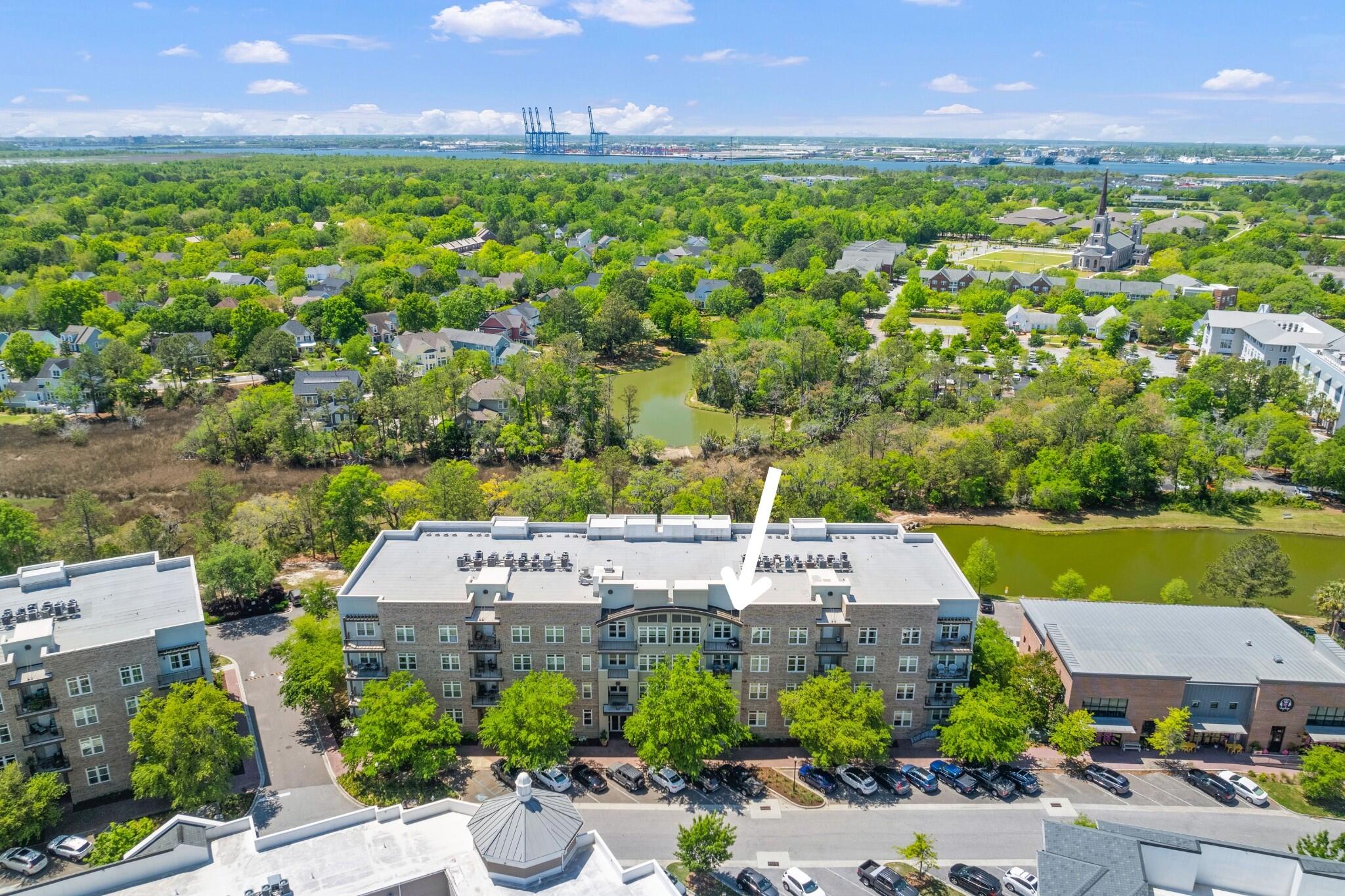 This top-floor 2-bedroom, 2-bath condo puts you just steps away from popular coffee shops, restaurants, fitness studios, and the scenic Waterfront Park. Enjoy the ease of low-maintenance living with private parking and relaxing amenities like a community pool and fitness center. The exterior of the building has been fully renovated, is surrounded by lush greenery, and offers access to miles of beautiful walking trails. Whether you're searching for a primary home, an investment property, or a lock-and-leave getaway, 125 Pier View is a fantastic opportunity.Why this condo? The top-floor location offers exceptional privacy and floods the space with natural light. You are also provided maximum privacy on the balcony. The kitchen features generous cabinet space, ample countertop prep areas, and well-appointed appliances to meet your cooking needs. New light fixtures in the entryway, dining, and living area add a modern touch, while tall ceilings enhance the open, airy feel throughout. Additionally, a private storage unit in the garage and in-condo laundry add even more convenience. 

This condo offers the best of Daniel Island living. Schedule a showing and experience it for yourself today!

*Buyer/buyer's agent to verify all information deemed important, including flood zone, school zone, square footage, acreage and fees.