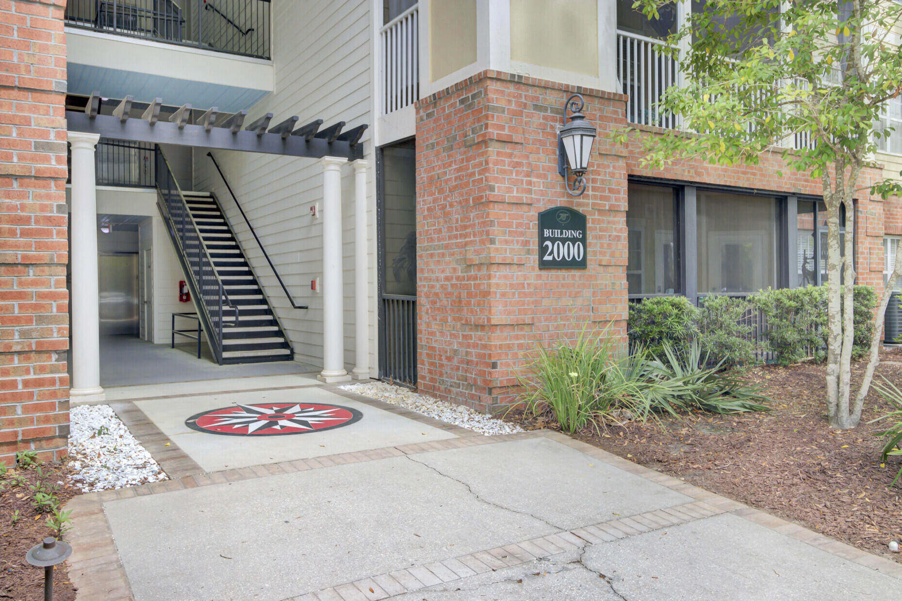 Welcome to this beautifully maintained 2-bedroom, 2-bathroom end-unit condo located on the second floor, offering both privacy and peaceful views. The screened-in porch overlooks the community pool, a serene pond, and a backdrop of mature trees--creating the perfect setting for morning coffee or evening relaxation. Inside, the home features a formal dining room ideal for entertaining, spacious bedrooms, and an abundance of natural light throughout. A PRIVATE GARAGE adds convenience and extra storage.Nestled in a gated community where the gates close at night for added peace of mind, residents enjoy a wide array of resort-style amenities. The neighborhood includes a dog park and dedicated dog wash station, as well as a car wash and vacuum area to keep your vehicle spotless. The clubhouse offers a movie theater, a well-equipped gym, and a kitchen complete with an ice machine, while outside you'll find a resort-style pool, grilling area, and a pavilion with charming porch swings. Walking trails wind through the community, connecting residents to a great lawn, recycling center, and even boat storage (available for a fee and with approval). This is a rare opportunity to enjoy comfort, convenience, and community all in one place.