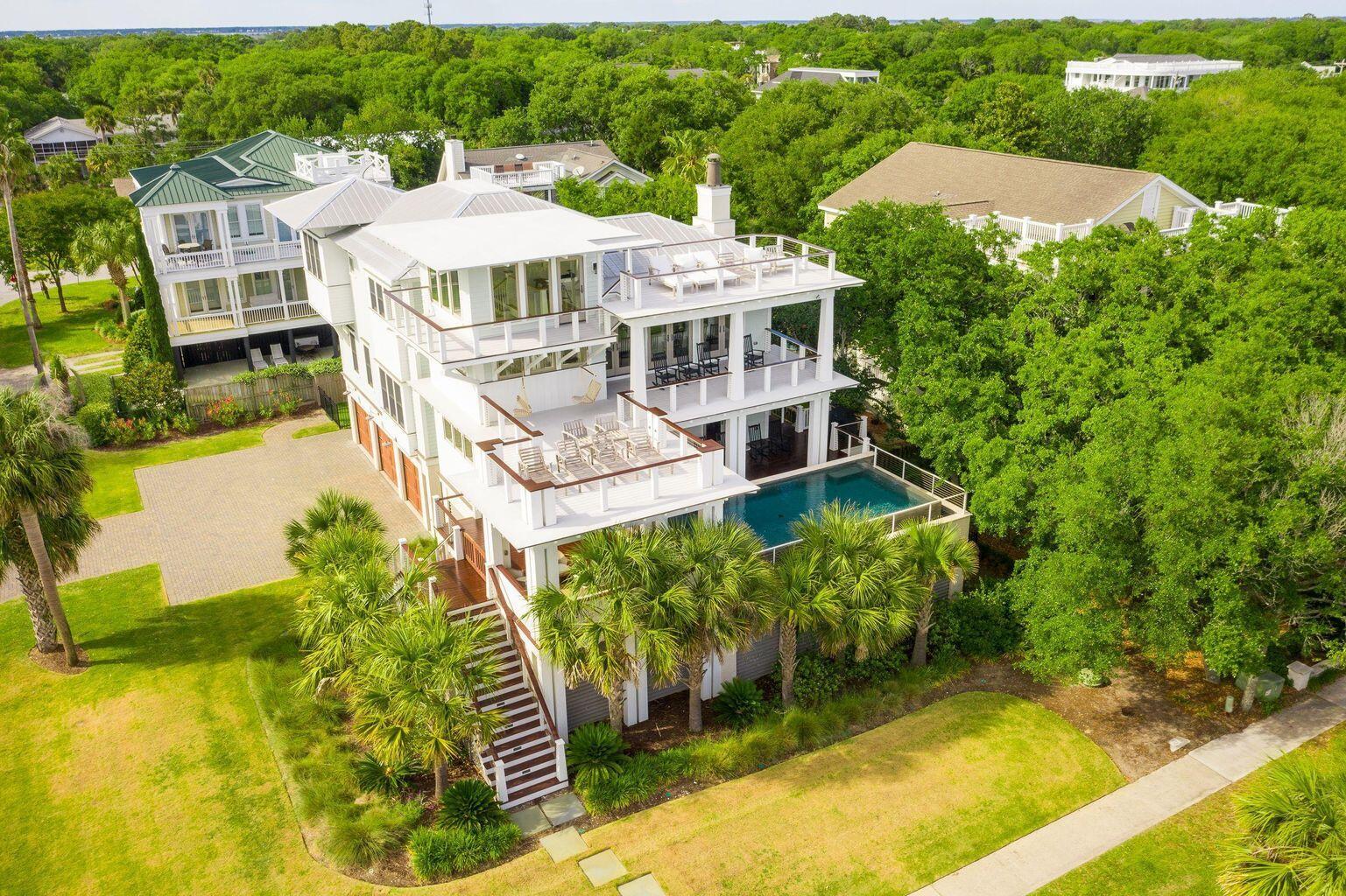 MOTIVATED SELLERS. PRICED TO SELL! Welcome to 4001 Palm Blvd, an iconic second-row coastal sanctuary on Isle of Palms offering breathtaking ocean views from both the second and third floors, direct beach access across the street, and a level of seclusion rarely found -- with no public beach parking anywhere surrounding the home. This one-of-a-kind location provides exceptional privacy, yet is just steps from the sand and Atlantic surf. Designed by renowned architect Carl McCants and meticulously furnished with designer pieces from Restoration Hardware, Serena & Lily, Frontgate, and Pottery Barn -- all included at no additional cost -- this fully stocked and turn-key residence defines effortless, elevated coastalliving. With over 5,000 square feet, 6 spacious bedrooms, 6.5 baths, plus two outdoor showers, this home offers a perfect blend of casual elegance and timeless sophistication. Whether used as a full-time residence, luxe getaway, or high-yield investment, this property delivers on every front. 

It currently commands a nightly rental rate of $2,250, making it an exceptional opportunity for a luxury vacation rental.

- Sophisticated Interiors & Chef's Kitchen
The heart of the home is a show-stopping chef's kitchen, complete with top-of-the-line Viking appliances, an 8-burner dual-fuel range, double ovens, a Blanco farmhouse sink, quartz countertops, custom cabinetry, a walk-in pantry, prep island, and dual-zone wine and beverage centers  a dream setup for both everyday living and elevated entertaining.

The open-concept layout flows seamlessly into expansive living and dining spaces, surrounded by natural light and Ipe decks that blur the line between indoors and out.

- Luxe Primary Suite & Spa Bath
The second-floor primary suite is a retreat unto itself, complete with a private sitting area or office nook, custom walk-in closet, and a spa-like en suite with a soaking tub, rainfall shower, dual vanities, and elegant coastal details.

- Guest Suites & Ground-Level Game Room
Five additional bedroom suites on the main level each include private en-suite baths with oversized, dual-head showers, providing luxurious comfort and privacy for guests. Also on this level: a fully equipped media/game room featuring a bar, two beer taps, and Golden Tee golf  all with direct access to the pool deck.

- Outdoor Oasis
The outdoor living spaces are nothing short of spectacular. An infinity-edge saltwater pool anchors the backyard, surrounded by synthetic turf for a lush, low-maintenance lawn, multiple lounging zones, and two outdoor showers. The expansive Ipe decking provides the perfect setting for dining al fresco or relaxing with panoramic ocean breezes.

Additional Highlights:
Sold fully furnished with high-end designer pieces

Ocean views from two levels

No surrounding public beach parking = unmatched privacy

Direct beach access across the street

Sonos surround sound throughout

Smart home wiring & central vacuum system

Brazilian cherry hardwood floors (recently refinished)

Metal roof, shiplap accents, elevator

4-6 car garage

Two Rinnai tankless water heaters for endless hot water

Minutes from the heart of downtown Charleston, and close to world-class golf, boating, and fine dining, this is truly the pinnacle of Lowcountry luxury living.