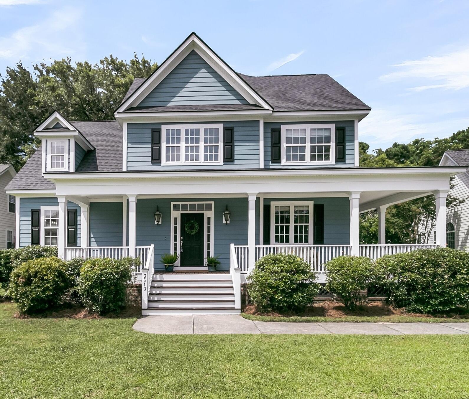 Welcome home to this charming Lowcountry retreat with a huge wraparound front porch & a spacious screened porch, perfect for enjoying the outdoors. Inside you'll find a bright, open-concept floor plan with soaring ceilings, fresh paint throughout & hardwood floors on the main level. The kitchen has an abundance of counter space, a gas stove & bar seating plus opens up to the family room w/ a gas fireplace. This home is the pefect layout for entertaining, but also allows for private living. The primary suite is conveniently located downstairs, while a large FROG with a private bath & separate staircase offers flexible living space. All other bedrooms are upstairs. Gorgeous Oak trees provide shade & privacy in the spacious backyard which can be fenced. Finally the home backs to trees/woods!