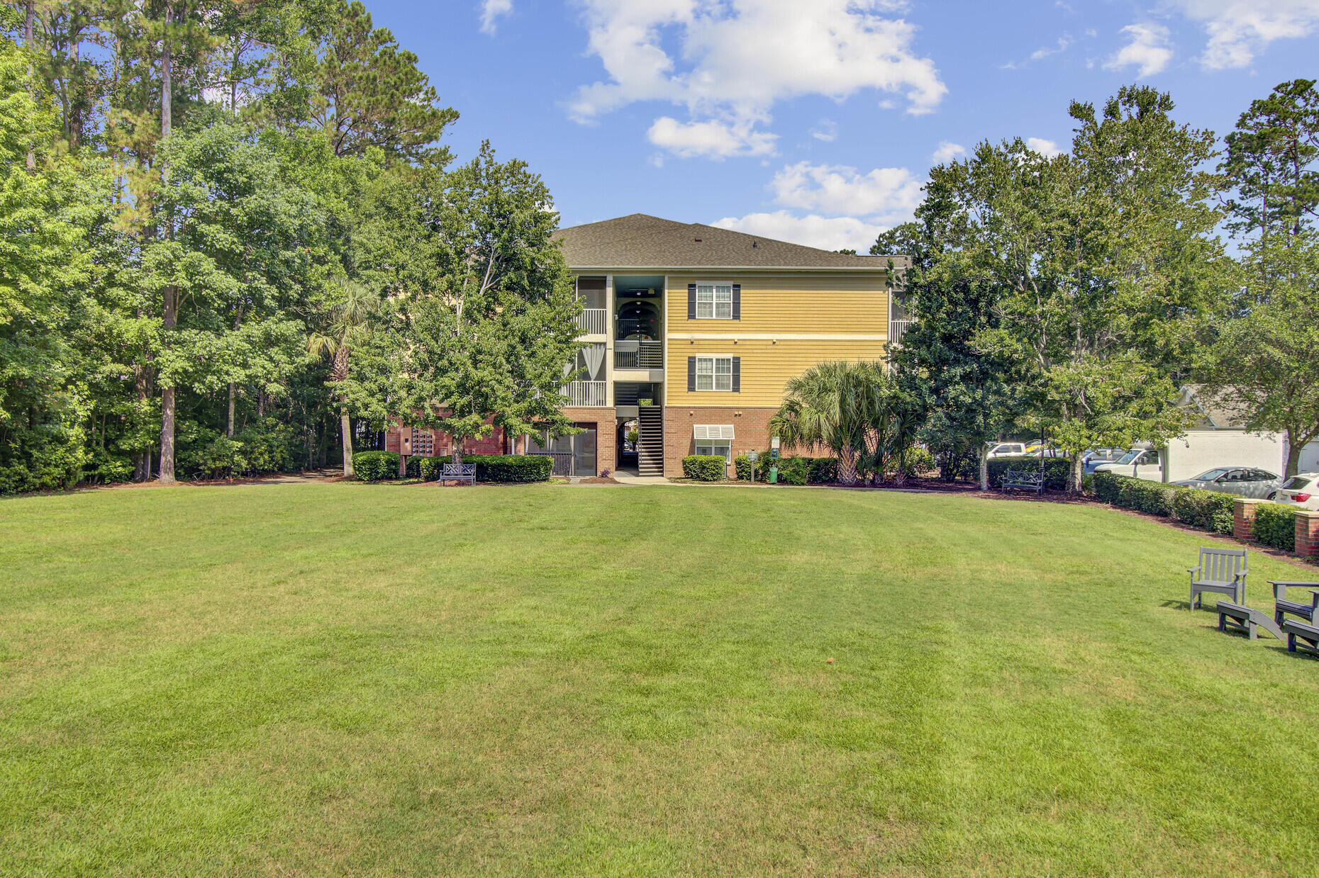 Welcome to The Battery at Park West -- a gated, amenity-rich community offering low-maintenance living in one of Mount Pleasant's most desirable locations. This spacious second-floor end-unit condo features two bedrooms and two full bathrooms, an open layout, and an eat-in kitchen. Just off the living room, a private screened-in porch offers the perfect spot to enjoy your morning coffee or unwind at the end of the day, surrounded by the peaceful setting of the community.The building is equipped with elevators for easy access, and the community is thoughtfully designed with resort-style amenities, including a beautifully maintained great lawn, a pavilion with swings, a dog park, on-site dog wash, and a car wash and vacuum station.Trash and recycling are located on-site for residents' ease and efficiency. For boating enthusiasts, boat storage is available for a fee with a permit.

The elegant clubhouse includes a full kitchen with icemaker, a fitness center, game room, theater room, and bathrooms. Residents also enjoy grilling stations near the pool, perfect for entertaining and relaxing. For added peace of mind, the gates are scheduled to close at night, creating a secure and serene environment.

Enjoy a lifestyle of comfort and convenience just minutes from top-rated schools, shopping, and the beaches.