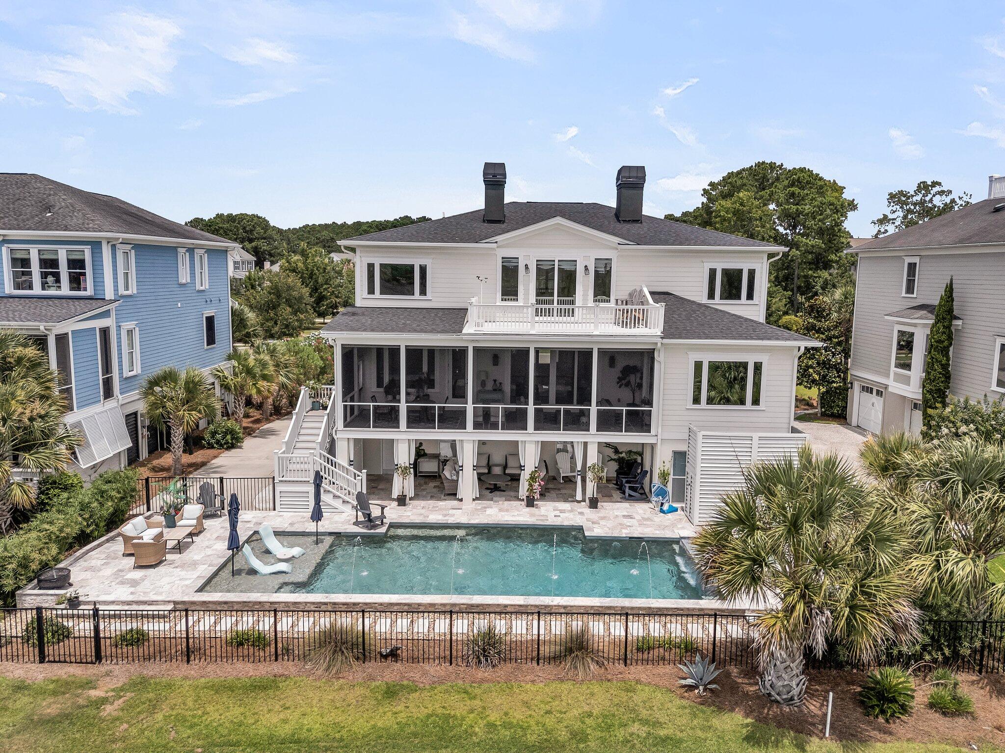Welcome to 1636 Rivertowne Country Club Drive -- a stunning marsh and golf front estate offering unmatched views of the Horlbeck Creek, Wando River, and even the Ravenel Bridge. Located in the prestigious Rivertowne Country Club, the home is over 4,000 sqft with five spacious bedrooms, which include a luxurious master suite on the main level and four and a half baths. This home is handicap accessible, including a 3-stop elevator, allowing access to all floors. Inside, the home showcases soaring 10-foot ceilings and 8-foot doors on the main level, complemented by elegant Brazilian cherry hardwood floors that run throughout both stories. Crown molding graces every room, highlighting the impeccable craftsmanship. The completely remodeled kitchen features quartzitecountertops/backsplash, hood & new appliances. Three gas fireplaces add warmth and ambiance to the living spaces. The spacious master suite offers two walk-in closets, a renovated master bath and a private office. This beautifully designed office features custom-built shiplap sliding doors for privacy and overlooks the golf course and marsh. Plantation shutters add a refined touch and provide both style and privacy throughout the home. The 3-bay (4 car) garage is nearly 2,000 additional square feet and features a full bath within steps of the pool and 500 sqft of temperature-controlled space. Gas lanterns illuminate both the front and rear screened porches, while all south-facing windows and doors are protected with UV film for added efficiency and comfort. 
 

Extensive upgrades between 2021 and 2025 have elevated the home's comfort, efficiency, low maintenance, and true resort feel. A completely remodeled master bath, kitchen, new roof, 2 state-of-the-art HVAC systems, new south-facing windows/doors, plus full exterior and interior painting of the home. An elevator services all levels of the home for added convenience, and makes the property handicap accessible. The expansive screened porch with composite decking is an extension of the main living space, as there is always a breeze off the water.

 

Upstairs, you'll find four oversized bedrooms,  each with walk-in closets. There is no carpeting anywhere in the home, creating a clean and sophisticated feel throughout. In addition, an amazing bonus room with its own private terrace offers the perfect retreat for relaxing or enjoying sweeping views and breathtaking sunsets. It also provides an excellent spot for viewing the frequent rocket launches from Cape Canaveral, FL.

 

Step outside to a resort-style oasis where a massive heated and chilled saltwater pool with an elevated spa, waterfall, extended tanning ledge, and enhanced water features is surrounded by travertine decking, including a large covered patio  (completed in 2022). Professional landscaping, custom outdoor lighting, full irrigation system, fenced backyard, and a new ground-level full cabana bath, plus rough ins for a pool kitchen area, provide endless possibilities for outdoor entertaining.

 

This resort-style living is just minutes from shopping, dining, beaches, top-rated schools, and downtown Charleston. This home is ideal as a primary residence or a luxurious second home. 1636 Rivertowne Country Club Drive is truly move-in ready  a pristine waterfront masterpiece that must be seen to be fully appreciated.