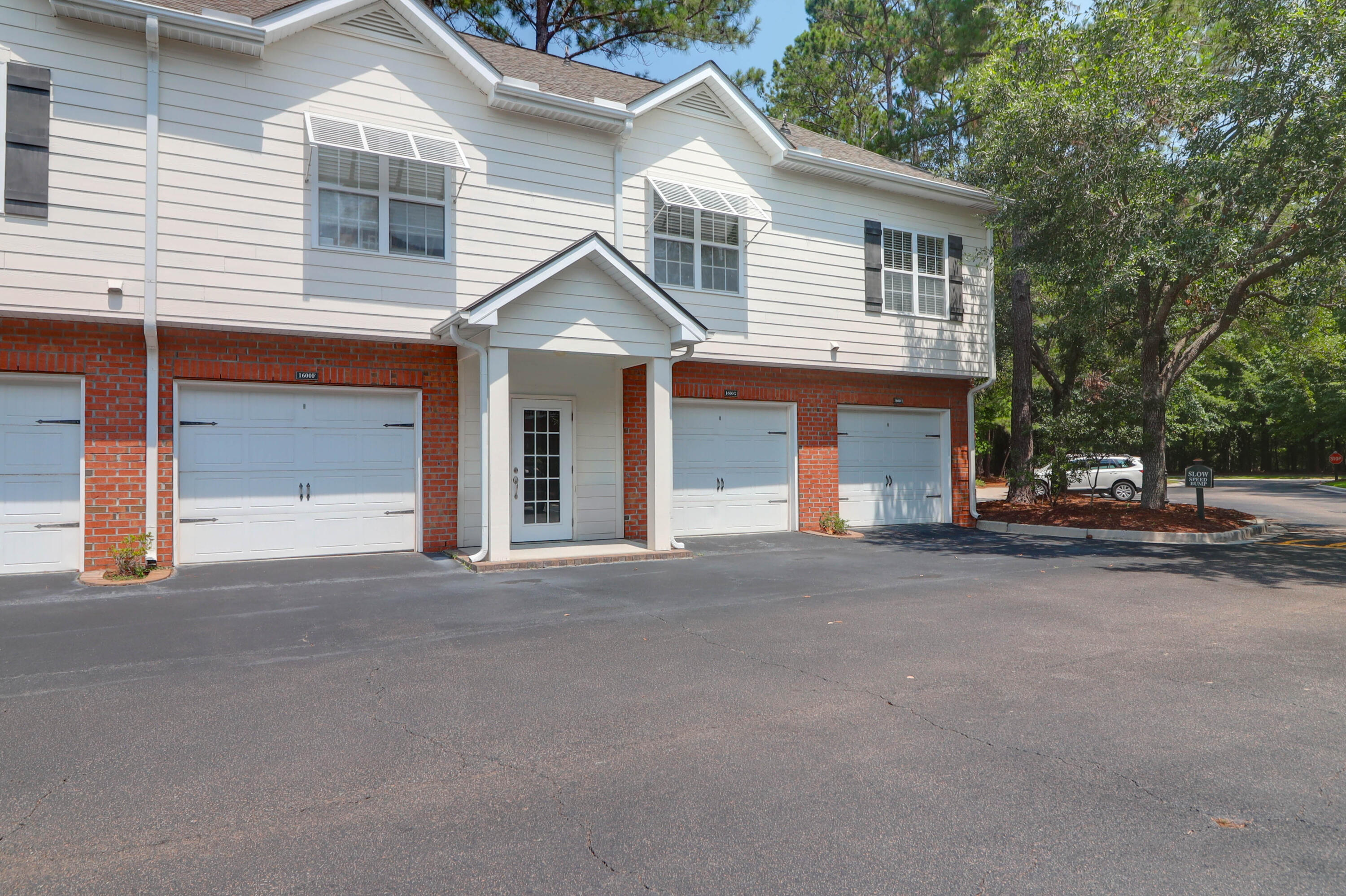 Beautiful condo with a garage! Enter foyer shared by on other neighbor directly from garage for safety and convenience. This is an end unit which overlooks a landscaped green space. Sit on deck in the evenings to enjoy a fantastic sunset. This unit includes most every upgrade that was originally offered by the builder, including: wood flooring in the kitchen and living areas, stainless steel appliances,  laundry area storage cabinets, tiled bathroom flooring and richly stained cabinetry. Other upgrades include under cabinet lighting, custom tile kitchen back splash, above kitchen window shelving, pantry storage , living room  ceiling fan and roller furling deck screen doors. The bedroom includes two closets. New carpet and freshly painted.. The garage is an oversized
1-car with ample space for a frig AND a whole wall of storage while still being able to comfortably park a mid-sized car. Amenities in The Battery are unsurpassed, with: a private clubhouse containing a wide screen theatre room, pool table, full kitchen/breakfast bar area and gaming tables overlooking a beautifully landscaped exclusive swimming pool with it's gas lamps and stainless steel gas master bar b q outdoor grill. Multiple ponds and miles of walking paths wind through the complex.