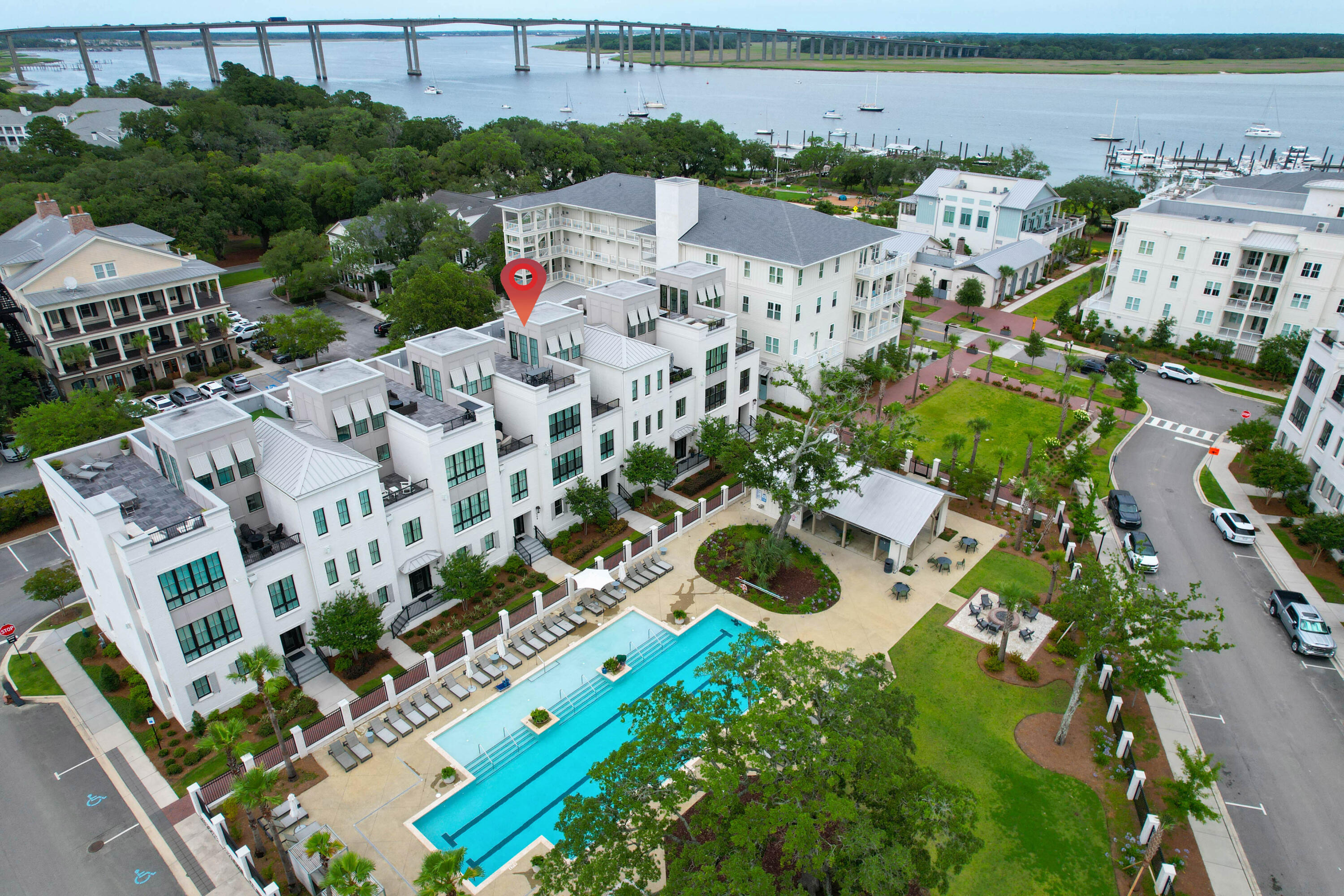 Experience the epitome of modern Lowcountry living at 506 Helmsman Street. This sophisticated three-bedroom, three-and-a-half-bath townhome is nestled within Daniel Island's exclusive Waterfront community. Completed in 2021, this elegant residence encompasses 3,476 square feet thoughtfully arranged across four levels.From the moment you arrive, you will appreciate the home's meticulous design and superior finishes. Notable features include a gourmet kitchen with high-end appliances, designer lighting, hardwood flooring, custom closets, and automated window shades. Soaring ceilings and oversized windows invite abundant natural light, creating an open and welcoming ambiance throughout. Upon entry, a spacious private office offers an ideal setting for working from home.A four-stop elevator provides effortless access to each floor, ensuring both convenience and comfort. The expansive rooftop terrace, spanning from front to back, is perfect for relaxation or entertaining guests, offering sweeping views of the resort-style pool and the Wando River. Immaculately maintained and move-in ready, this exceptional property presents a rare opportunity to enjoy refined coastal living in one of Charleston's most desirable communities.

Please confirm any details deemed important in the decision-making process. Buyer pays a one-time neighborhood enhancement fee to Daniel Island Community Fund at closing and an estoppel fee to the Daniel Island Property Owners Association. Daniel Island Resale Addendum will be required on offer to purchase