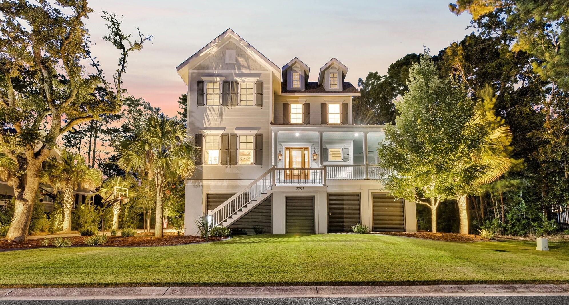 Your dream home awaits! Modern luxury meets nature. Nestled within Park West's coveted Masonborough neigborhood you'll discover this custom built luxury sanctuary, where sophisticated living meets thoughtful design. This expansive 2018 built five-bedroom, six bath home spans 3,891 square feet and boasts a relaxing outdoor living space, patio and bar all overlooking a private lagoon. Architecture enthusiasts will appreciate the superior construction quality evident throughout the home. The interior features a seamless open floor plan anchored by a chef's kitchen adorned with Thermador stainless appliances, island, and calcutta quartz countertops. Relaxing living room with gas log fireplace overlooking a stunning nature filled backyard with screened porch. An impressive master suite awaitsadjacent on the ground floor boasting multiple walk in closets, tray ceiling and decadent master bath. One other spacious bedroom/office on the 1st floor. The second-story living space offers versatility for families seeking additional mother in law suite or retreat areas. Loft area off the stairwell with 2nd additional living room/theatre space and 3 additional bedrooms with 3 baths. In addition, you'll be the envy of the neighborhood with a full covered outdoor living room with fireplace, fire pit, pro basketball hoop, pond views and impressive indoor/outdoor patio bar with mini-split and bathroom. The perfect hotspot for entertaining friends and family. Home also features spacious driveway for guests and a 3 car garage accommodating 4+ vehicles, golf cart and storage. Home also has an elevator shaft in place with easy set up to accommodate all guests on all 3 floors. And the high end washer and dryer conveys with the home. All this and more complete with Park West's unmatched amenities and Mount Pleasant's shopping/schools make 2295 Middlesex Street the community's home's crown jewel. Contact today for a chance for a private viewing!