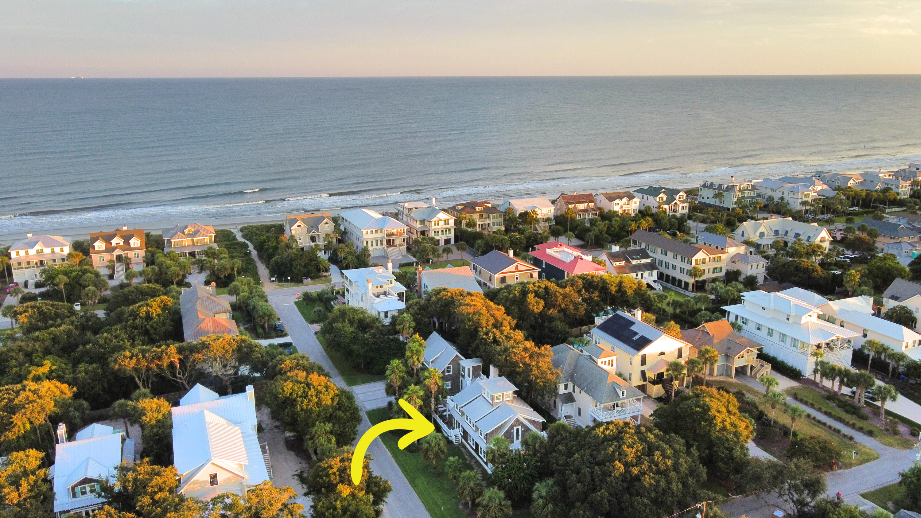 If you are looking for a truly unique home on the Isle of Palms that is just a few steps from the beach, then this is the property is for you!  ''Bea's Nest'' was originally owned by acclaimed American poet Beatrice Witte Ravenel, and the home blends the rich history of Isle of Palms and Sullivan's Island with all of the  conveniences of modern living.  Set on a quarter-acre corner lot very close to the beach path, the home spans approximately 3,685 square feet and features five spacious bedrooms and four full bathrooms, including a separate, fully equipped in-law suite with above the garage with a large bedroom, a full bath, kitchenette, and its own living room making it ideal for guests, multi-generational living, or short-term rental flexibility.  Inside the main house, the front porc h leads you into the light-filled living room and the large kitchen/dining area.  Both spaces are perfect for entertaining, and the kitchen is fully equipped with a stainless refrigerator, gas cooktop, wall oven, built in microwave, dishwasher, and a farm sink built into a large island with bar seating.  Upstairs in the main house are 2 guest rooms and a full bath in addition to a spacious primary bedroom that has a beautiful en-suite bathroom, a walk-in closet, and outside porch access with plenty of room for seating and a great view overlooking the pool.  Back downstairs, the kitchen and dining area spills out into the pool-side living area that is extremely cozy with a fireplace, TV, and customized, roll-up garage doors to the pool creating the option for both indoor and outdoor living spaces.  The far end of the property has a huge 3-car garage with the aforementioned in-law suite situated above.  Overall, the property is very private having mature landscaping and plenty of porch space all centered on outdoor living and a laid back island lifestyle, and yet it is within walking distance to the restaurants, shops, and grocery store on the island.  Whether you're seeking a full-time residence, luxury beach rental, or legacy family home, Bea's Nest offers a rare opportunity to own a piece of Charleston coastal history with every modern amenity.