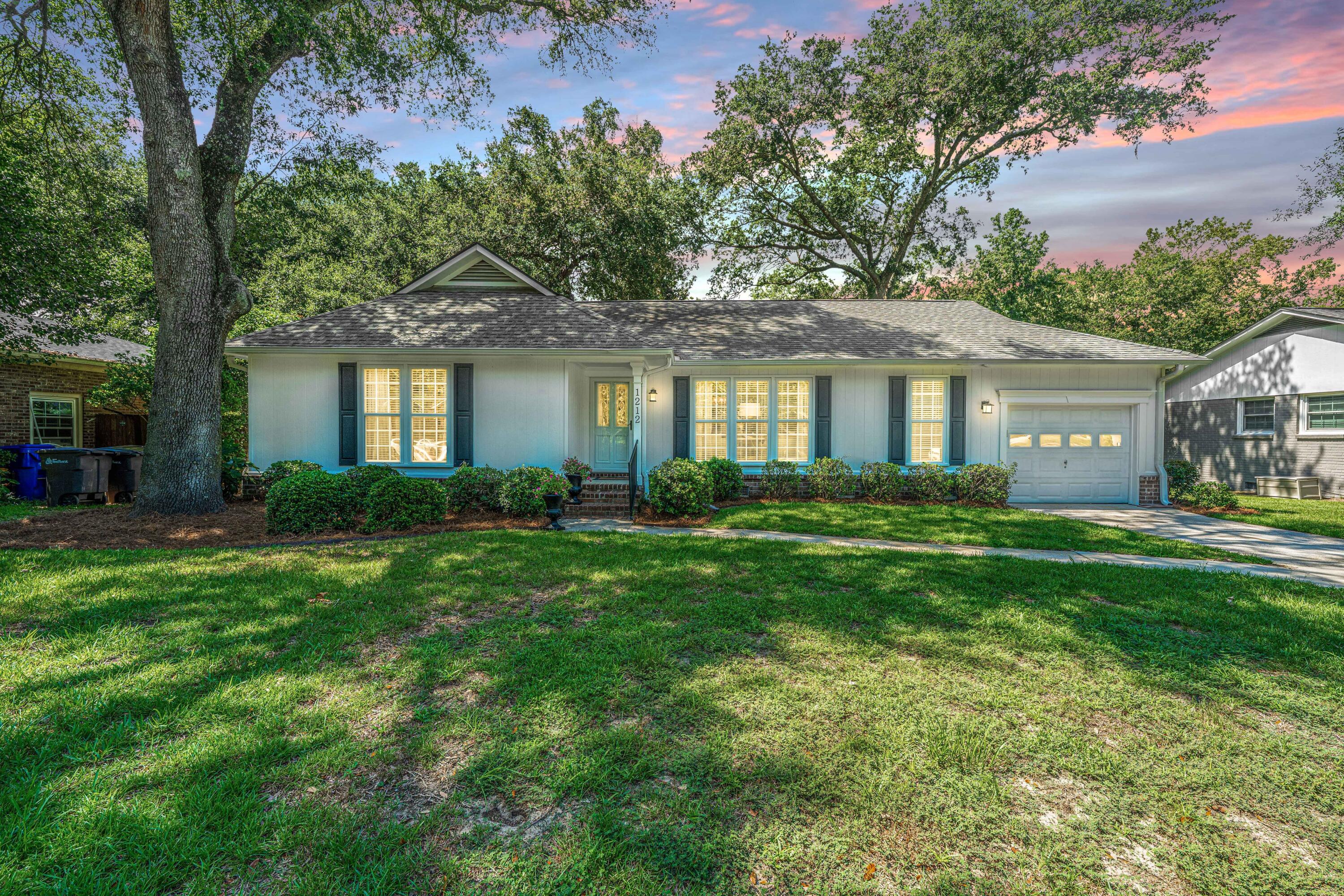Welcome to this stunning and beautifully maintained home situated on a quiet cul de sac street only minutes from downtown Charleston!  This gorgeous ranch style home offers the perfect opportunity to live in an amazing property in a wonderful location!The heart pine flooring and custom trimwork flow throughout this home and combine to provide a comfortable and inviting atmosphere.  To the right of the foyer is the living room/sitting area boasting many large windows which bring in ample natural light.  The dining room area is open and airy and offers the perfect place to dine.  The recently renovated kitchen is amazingly appointed, boasting plenty of ceiling height,custom cabinetry, granite countertops and stainless appliances.  The subway tile backsplash compliments the stainlesssteel range hood to make this kitchen one of the many centerpieces of this fine property.  The kitchen boasts a full butler's pantry/cafe area, providing plenty of storage and the perfect place for the coffee maker.  A custom built in desk in the kitchen is situated in a bay window and overlooks the beautiful backyard.  The large and private family room is situated on the back of the home and is graced with custom trimwork on the ceiling as well as a large gas log fireplace.  With custom built in shelving and cabinetry as well as a cathedral ceiling, this family room feels refined, open and comfortable.  The hallway leads to the private owners retreat, boasting heart pine flooring and custom built-ins.  A large owner's bath is accessed from the primary bedroom and is graced with a vanity featuring travertine stone countertops and dual undermount sinks.  The glassed in shower boasts Italian porcelain tile, giving it a high end feel.  There are two guest bedrooms with both sharing a hall bath featuring a stone topped vanity with undermount sink.  Accessed from the kitchen is a walk-up attic, providing for plenty of climate controlled storage space.  The deck on the back of the home overlooks the lush and landscaped yard, providing the perfect place to entertain or to relax at the end of the day.  A stone tiled walkway through the back yard leads to a wonderful brick patio, offering yet another area to enjoy the large trees and beautiful landscaping.  This amazing home provides the perfect opportunity to live in a gorgeous home close to downtown and all Charleston has to offer!