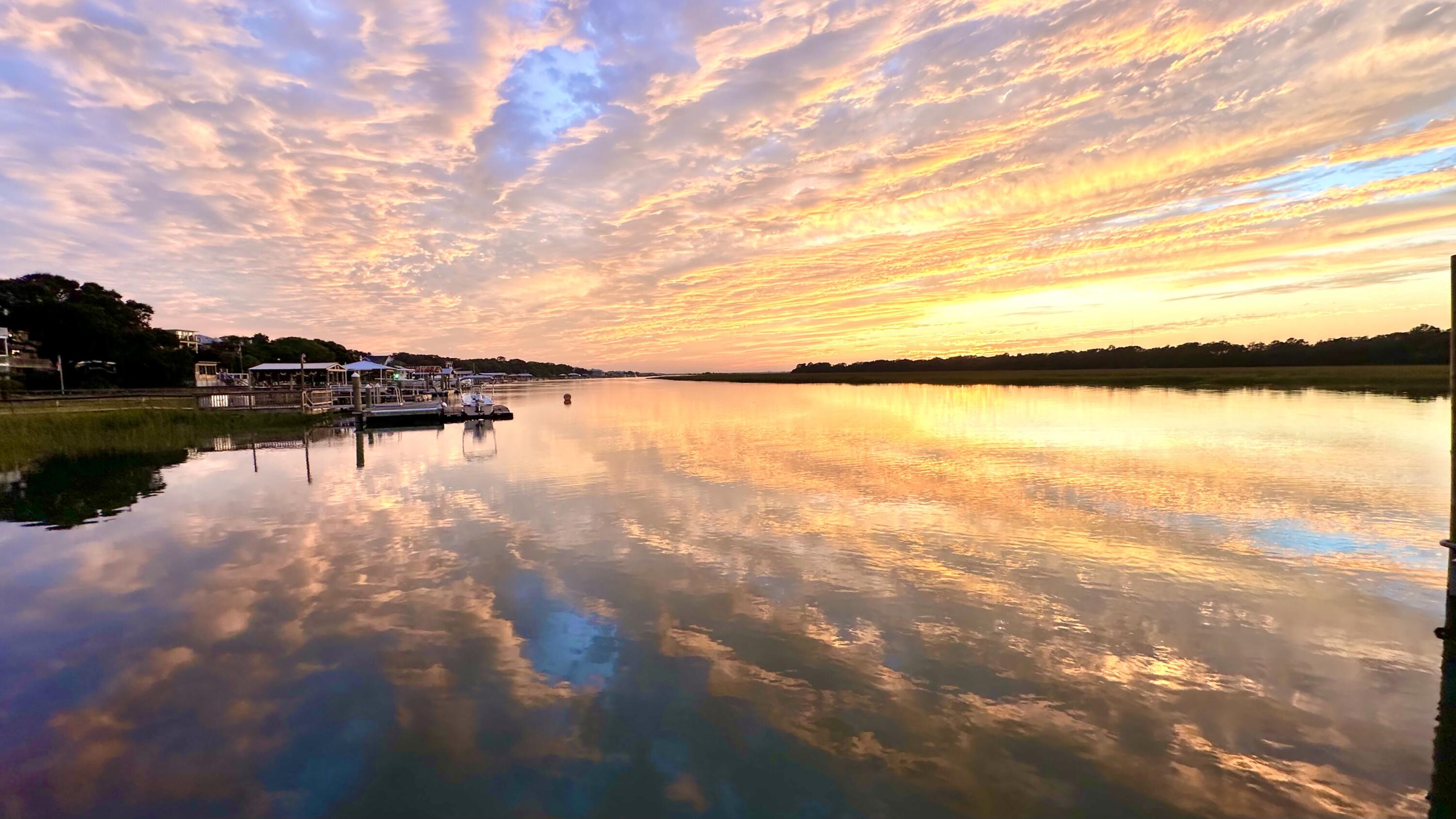 WONDERFUL RARE OPPORTUNITY ON THE ISLE OF PALMS TO OWN LARGE APROX 110 FEET OF FRONTAGE ON HAMLIN CREEK---TWO-- SIDE BY SIDE DEEP WATER LOTS! VIEWS!! VIEWS!! VIEWS!!! DOCK ON LOT 3---REMODEL THE BRICK RANCH,  BUILD YOUR NEW HOME OR TAKE ADVANTAGE OF THE SURVEY WHICH HAS BOTH LOTS THAT CAN BE BUILT ON SEPARATELY.SURVEY WITH CRITICAL LINE CERTIFICATION, SURVEY WITH SETBACKS AND TREES AND TREE PROTECTION MARKED , SOIL TEST COMPLETED AND DRAWN BUILDABLE FOOTPRINT OF HOUSE ON EACH LOT.CLOSE TO THE BEACH, GROCERY STORE, RESTAURANTS, SHOPPING, RECREATION CENTER, TENNIS AND PICKLEBALL COURTS, EXERCISE AREA, CLASSES, PLAY PARK AND DOG PARK