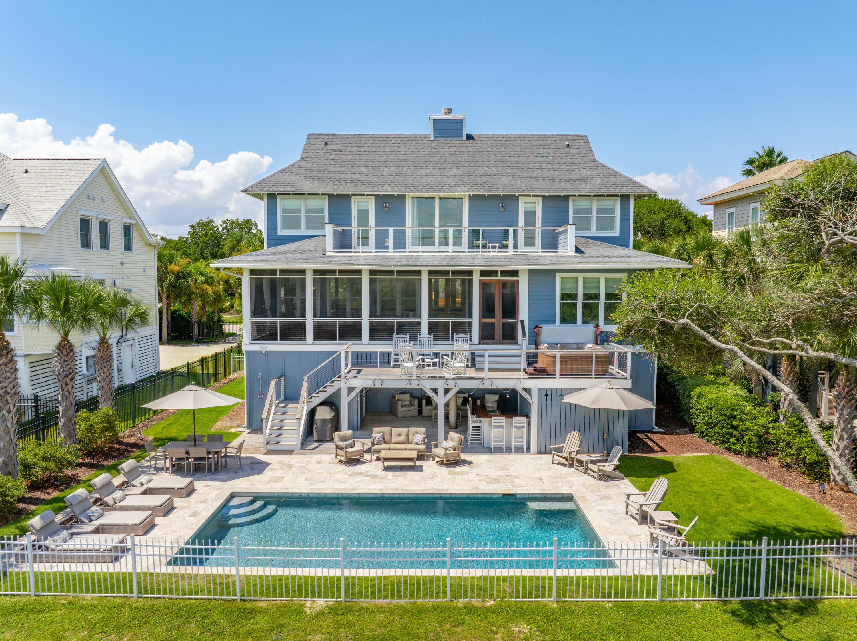 Completely renovated in 2017, this stunning oceanfront home sits on over an acre lot in one of the most stable and desirable areas of Isle of Palms. Ideally locate near the recreation center and within walking distance to the shops and restaurants. This home offer s perfect balance of privacy and convenience. Featuring a spacious open floorplan, the expansive main living area includes a beautifully designed kitchen with Thermador appliances, a generous dining area and a large, screened porch-ideal for enjoying breathtaking ocean views. The primary suite, located on the main floor, opens directly to the porch and decks creating a seamless indoor-outdoor experience. Family and guests can retreat upstairs to one of 3 bedrooms (1 with ensuite bath), offering guest comfort and privacy.